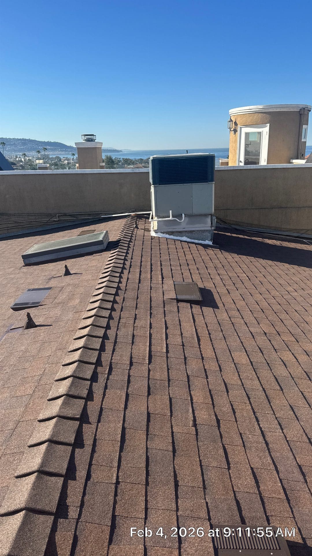 Asphalt shingle hip roof with ridge cap, skylight, vents, rooftop HVAC unit | Roof Replacement Inc Asphalt shingle hip roof with ridge cap, skylight, vents, rooftop HVAC unit — Roof Replacement Inc