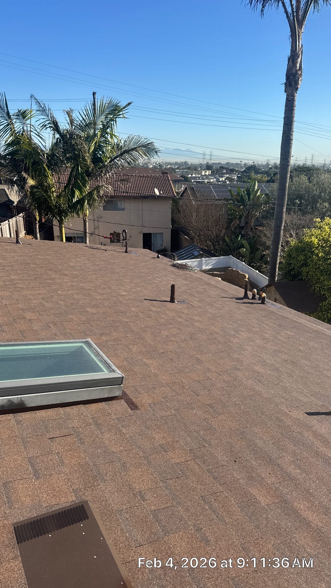Asphalt shingle roof with skylight, pipe boot, and roof vent — Roof Replacement Inc