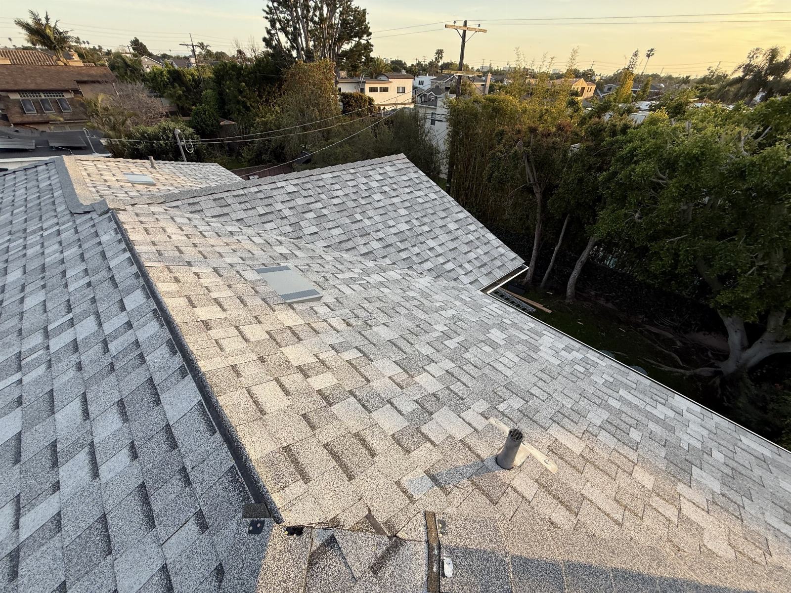 Asphalt shingle roof with pipe vent and skylight vents | Roof Replacement Inc Asphalt shingle roof with pipe vent and skylight vents — Roof Replacement Inc