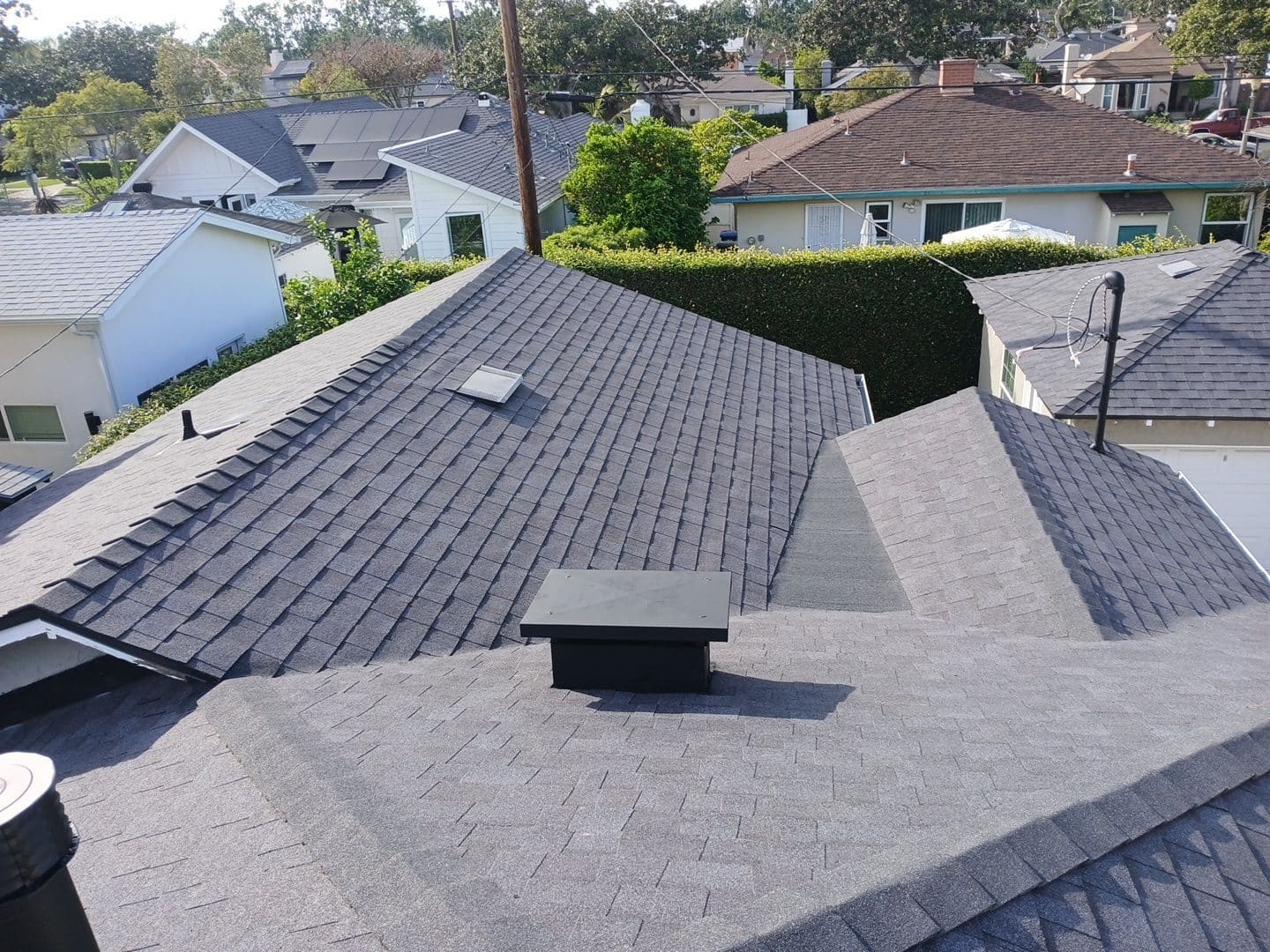 Grey asphalt shingle roof with vents, valleys, and skylights | Roof Replacement Inc Grey asphalt shingle roof with vents, valleys, and skylights — Roof Replacement Inc
