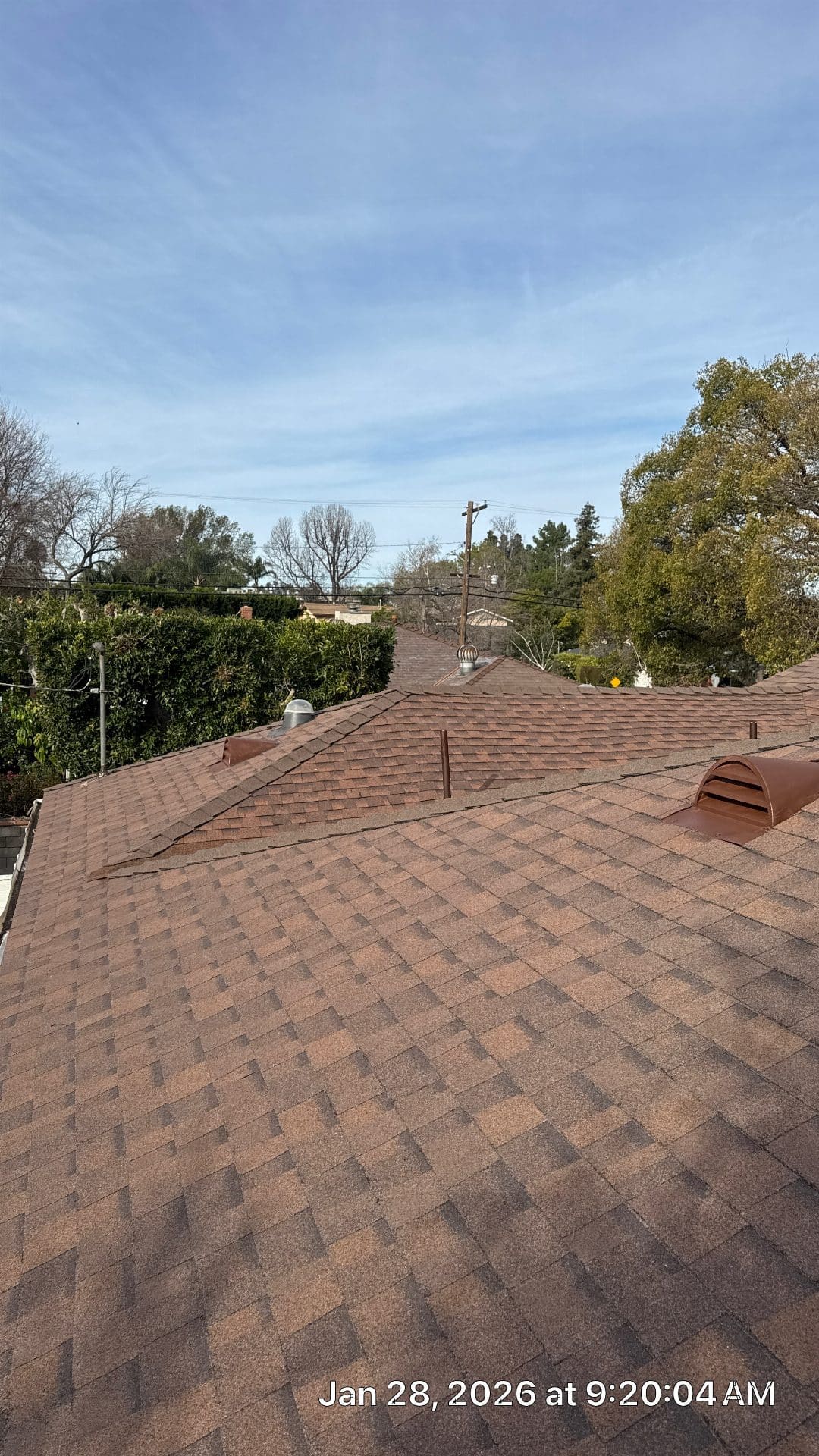 Completed asphalt shingle roof with ridge vents and turbine vents — Roof Replacement Inc