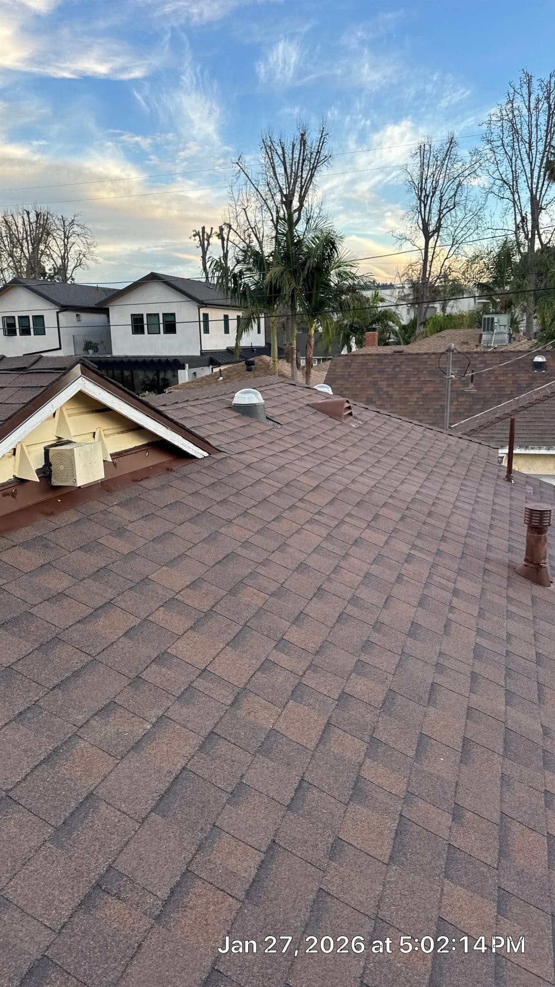 Brown asphalt shingle roof with vents and mini-split unit | Roof Replacement Inc Brown asphalt shingle roof with vents and mini-split unit — Roof Replacement Inc