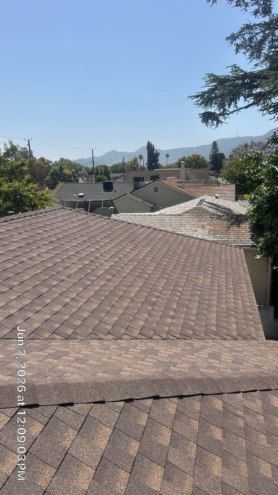 new brown asphalt shingle roof with valley flashing detail — Roof Replacement Inc