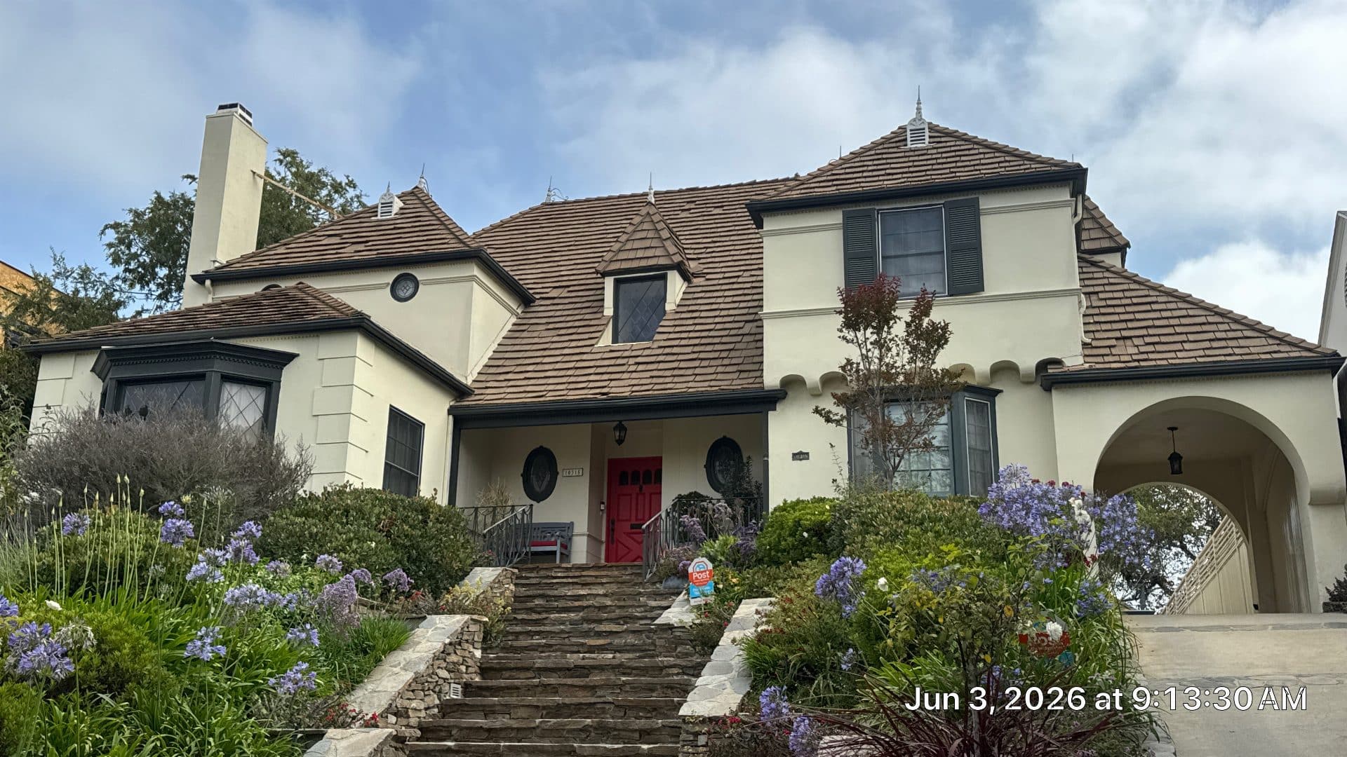 Two-story stucco home with brown clay tile roof, multiple dormers | Roof Replacement Inc Two-story stucco home with brown clay tile roof, multiple dormers — Roof Replacement Inc