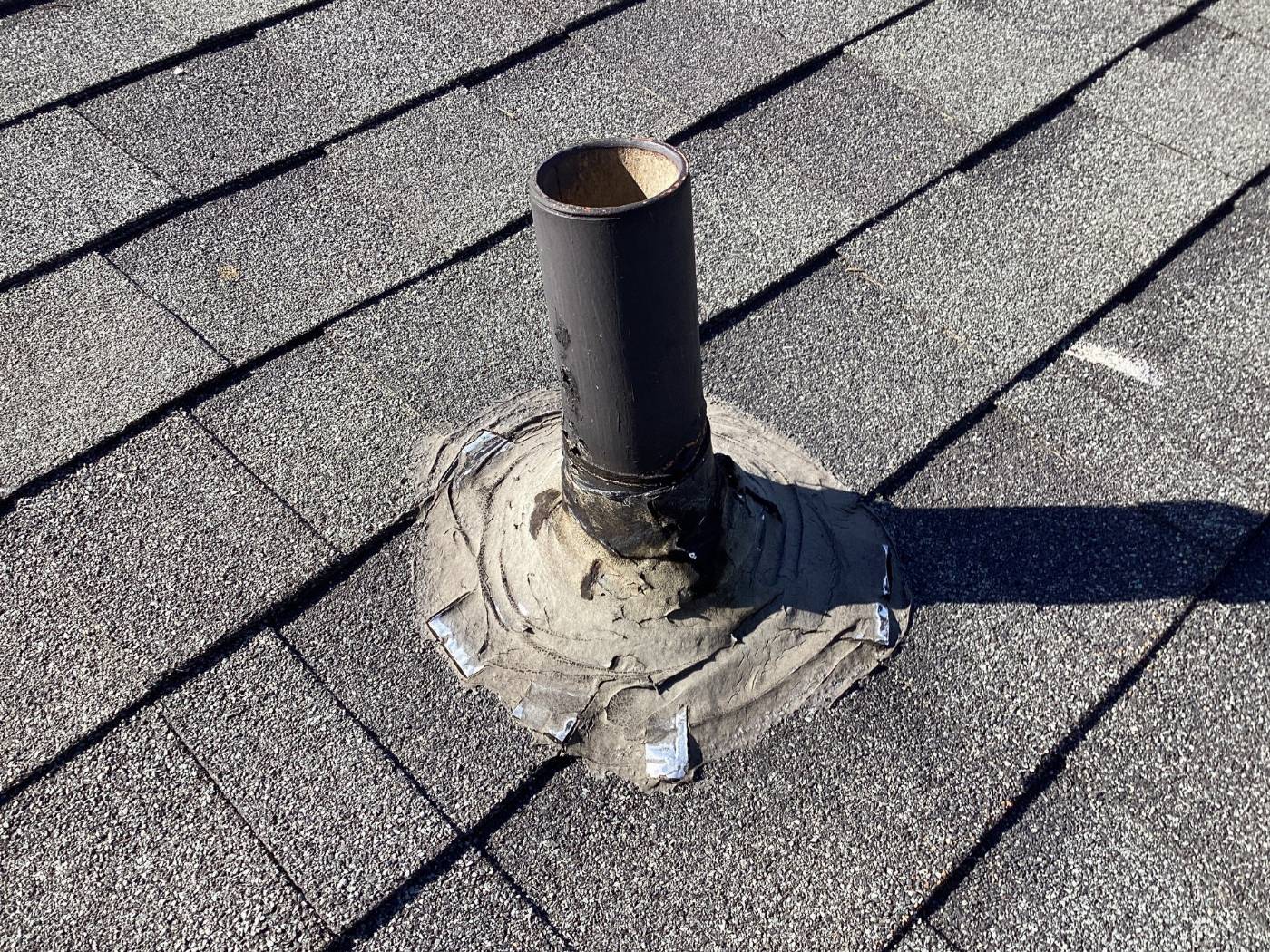 Deteriorated pipe boot flashing on asphalt shingle roof in Calabasas | Roof Replacement Inc deteriorated pipe boot flashing on asphalt shingle roof — Calabasas — Roof Replacement Inc
