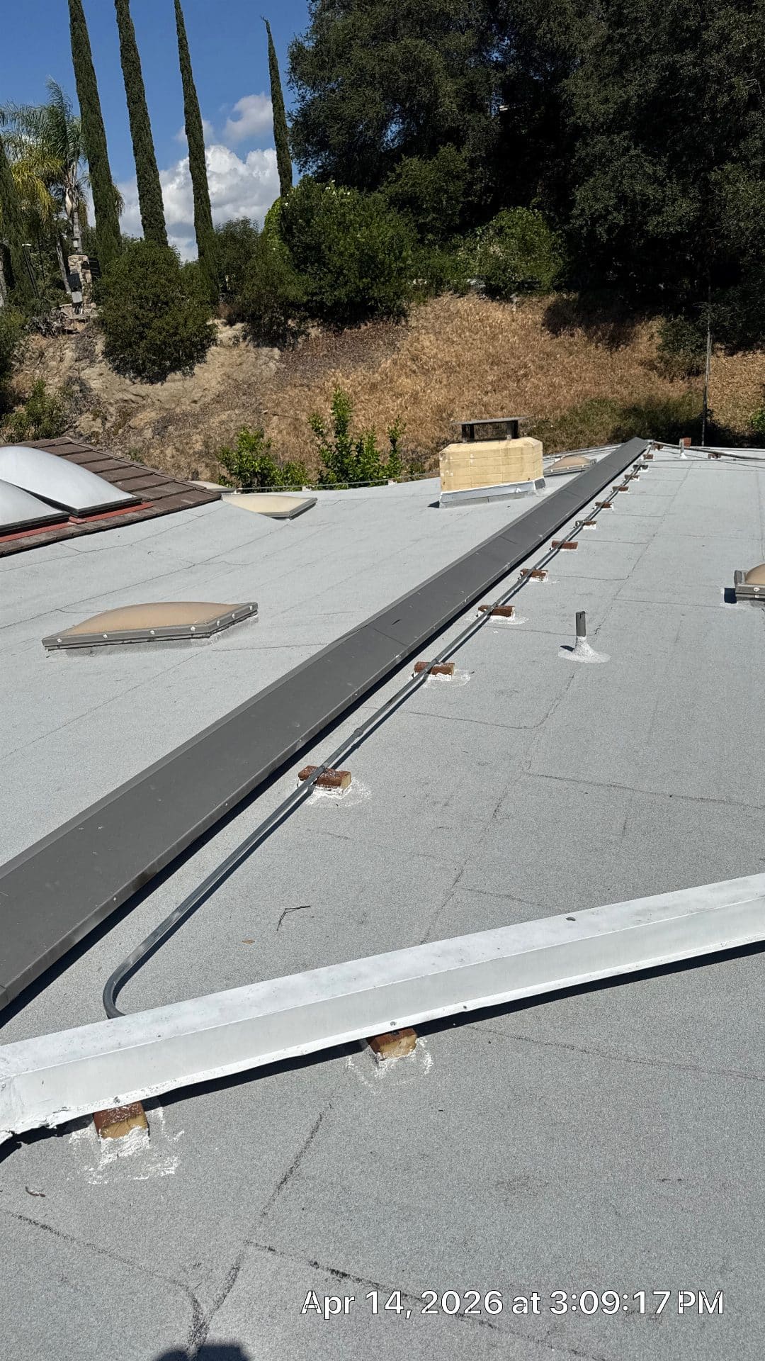 Flat roof with solar rail mounts skylights and gravel surface in La Cañada Flintridge | Roof Replacement Inc flat roof with solar rail mounts skylights and gravel surface — La Cañada Flintridge — Roof Replacement Inc