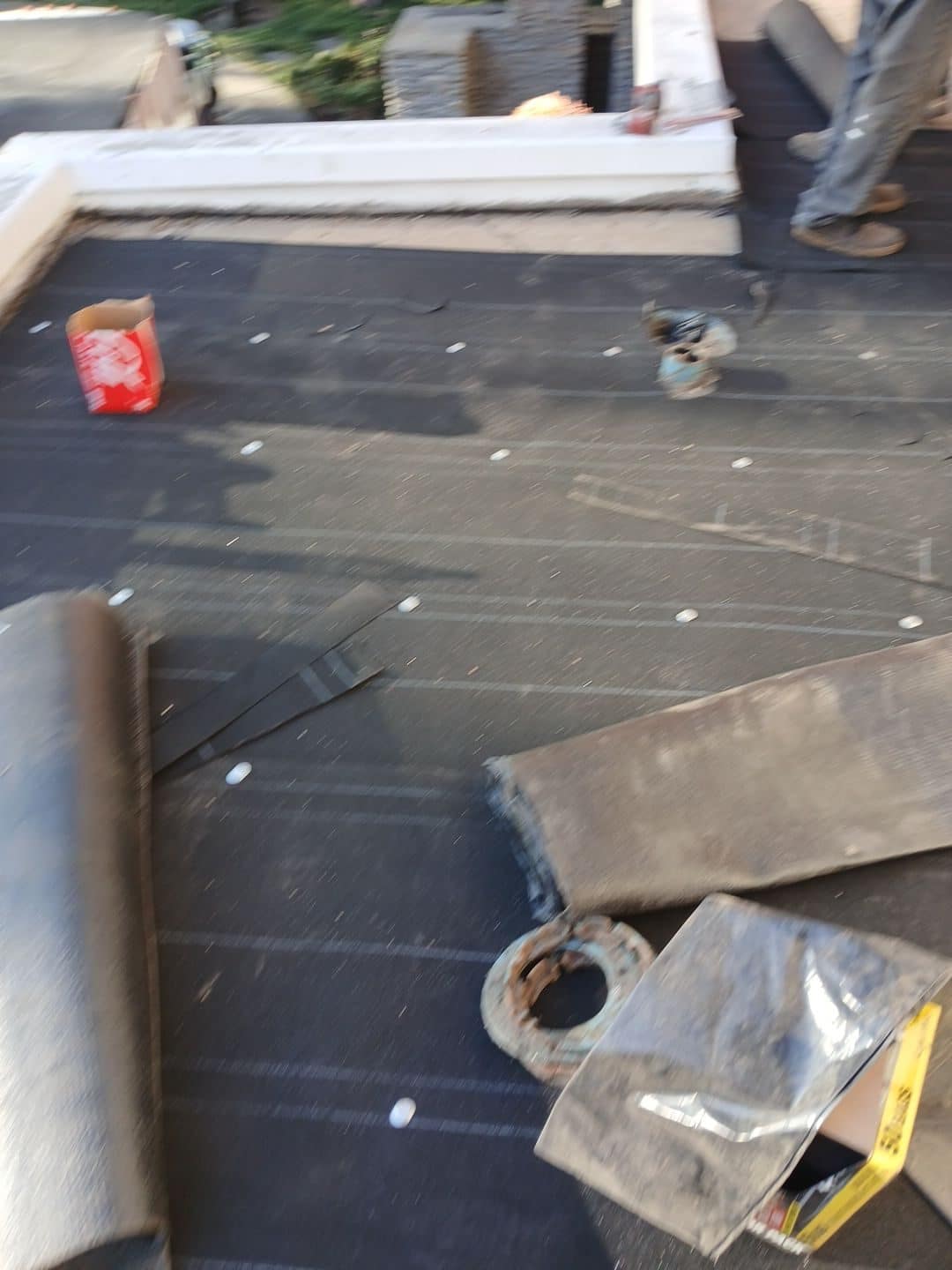 Flat roof underlayment installation with roofing nails tools and materials in Beverly Hills | Roof Replacement Inc flat roof underlayment installation with roofing nails tools and materials — Beverly Hills — Roof Replacement Inc