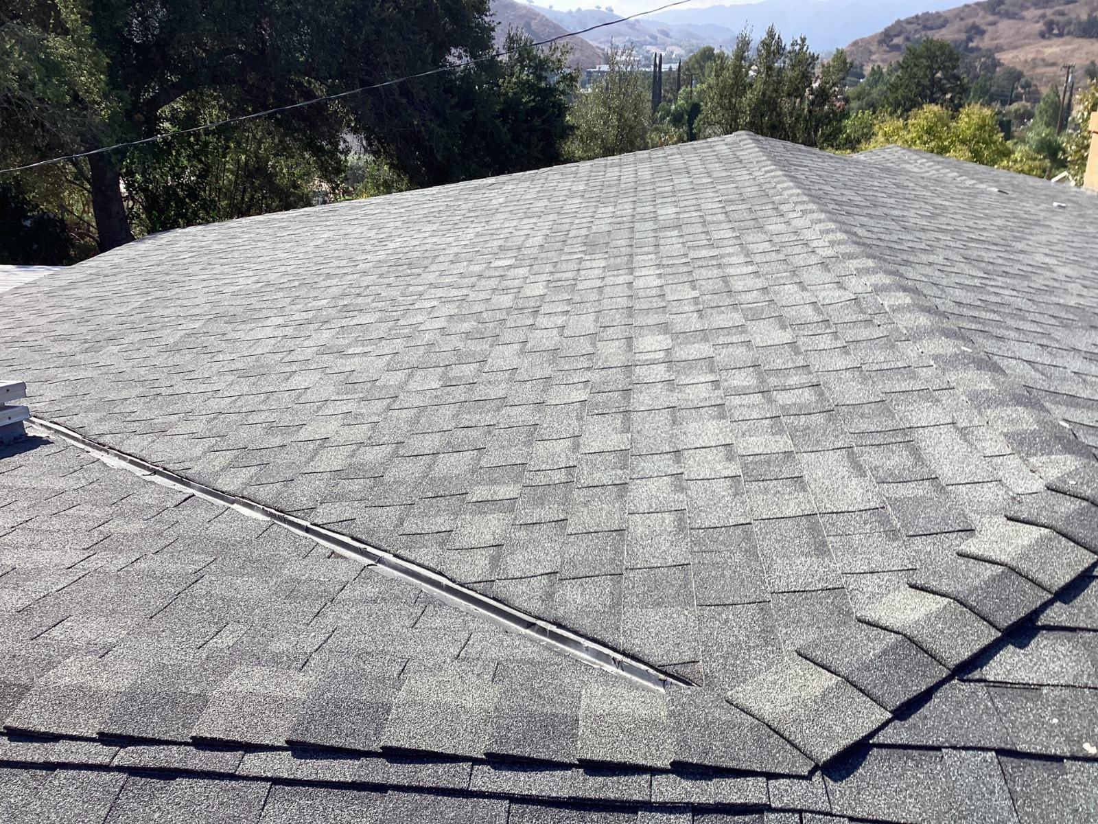 gray asphalt shingle hip roof with ridge vent installed — Calabasas — Roof Replacement Inc