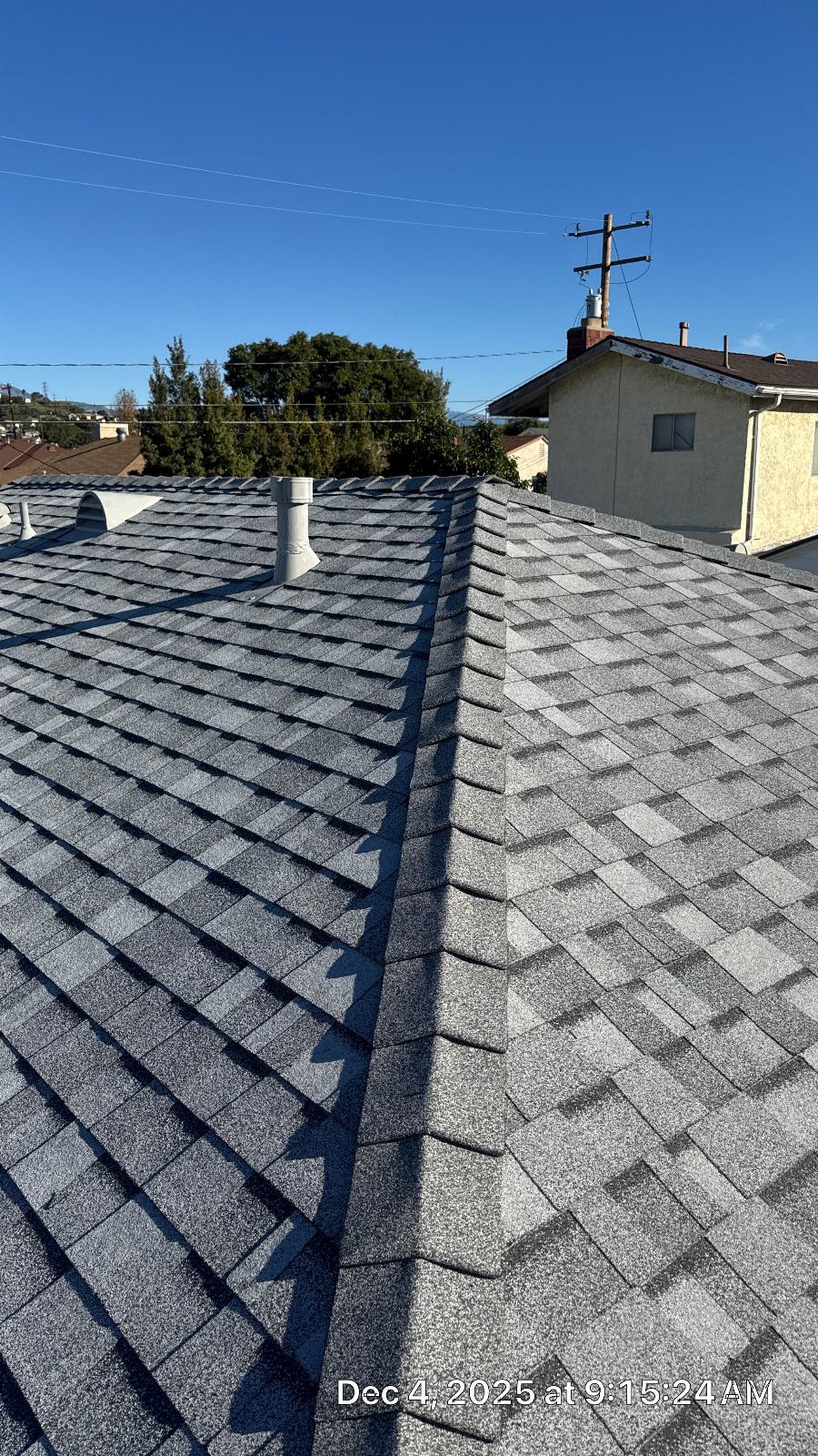 New gray asphalt shingle roof with hip ridge and plumbing vent | Roof Replacement Inc New gray asphalt shingle roof with hip ridge and plumbing vent — Roof Replacement Inc