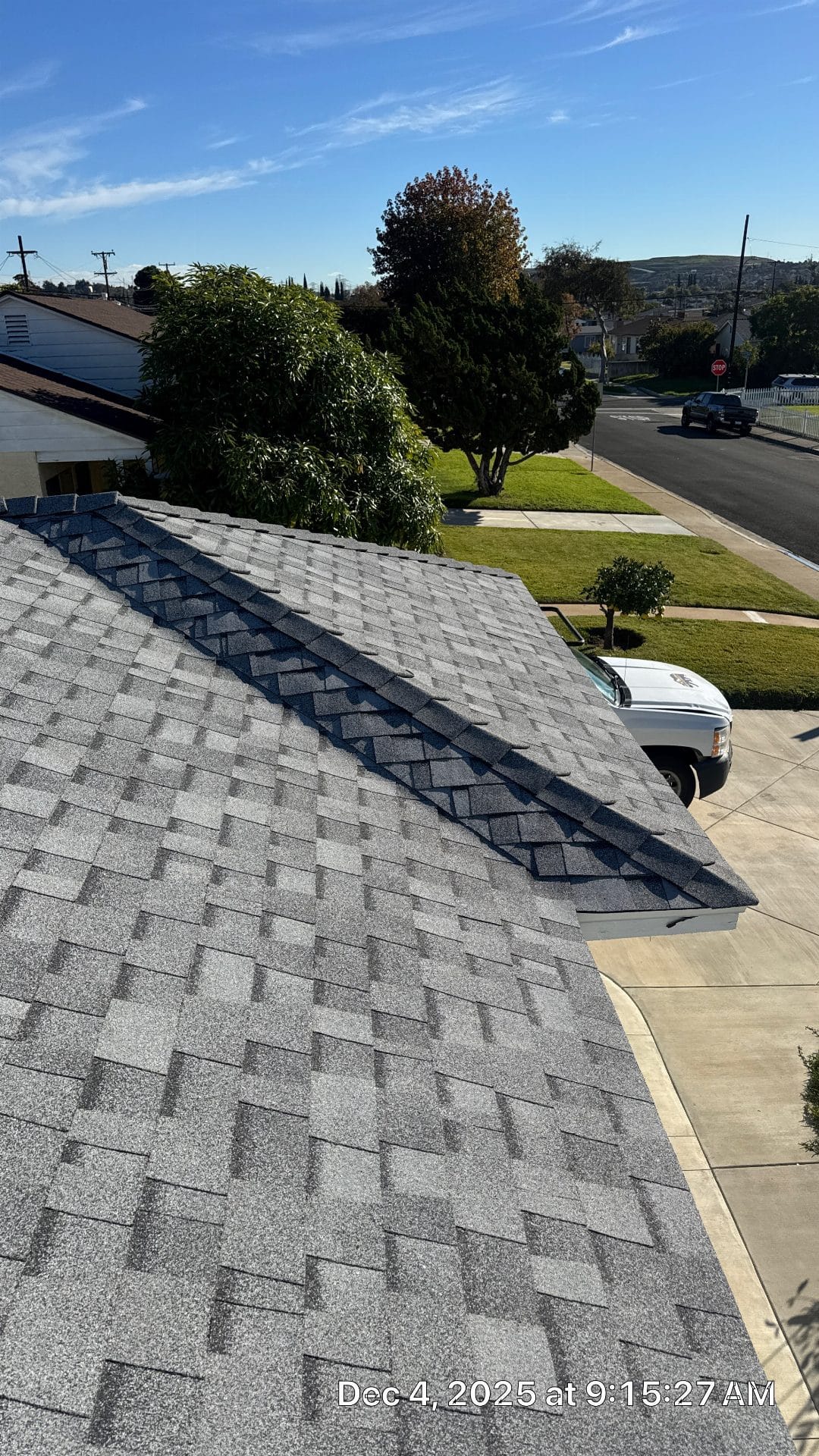 Gray asphalt shingle roof with hip ridge cap completed | Roof Replacement Inc Gray asphalt shingle roof with hip ridge cap completed — Roof Replacement Inc