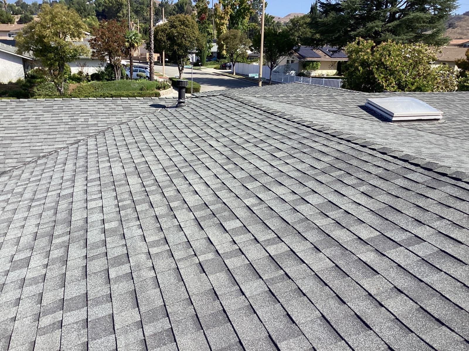 gray asphalt shingle roof with skylight and vent pipe — Calabasas — Roof Replacement Inc