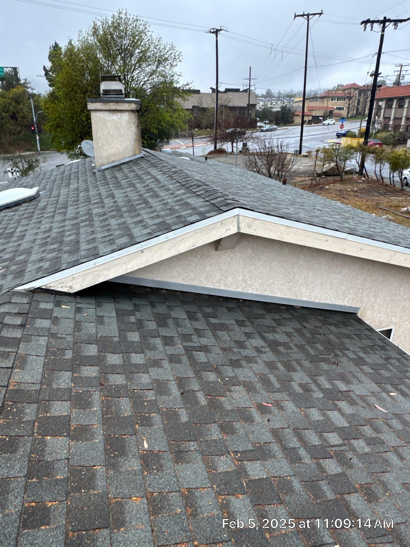 Gray asphalt shingle roof with chimney and metal drip edge in La Crescenta-Montrose | Roof Replacement Inc gray asphalt shingle roof with chimney and metal drip edge — La Crescenta-Montrose — Roof Replacement Inc