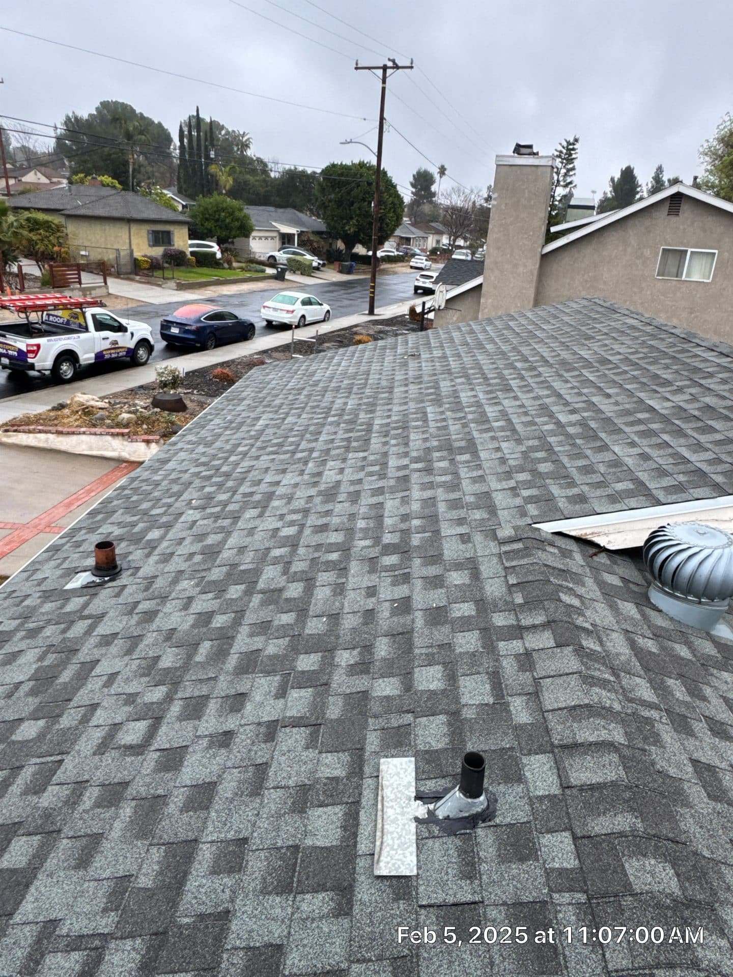 Gray asphalt shingle roof with pipe boot flashing and turbine vent in La Crescenta-Montrose | Roof Replacement Inc Gray asphalt shingle roof with pipe boot flashing and turbine vent — La Crescenta-Montrose — Roof Replacement Inc