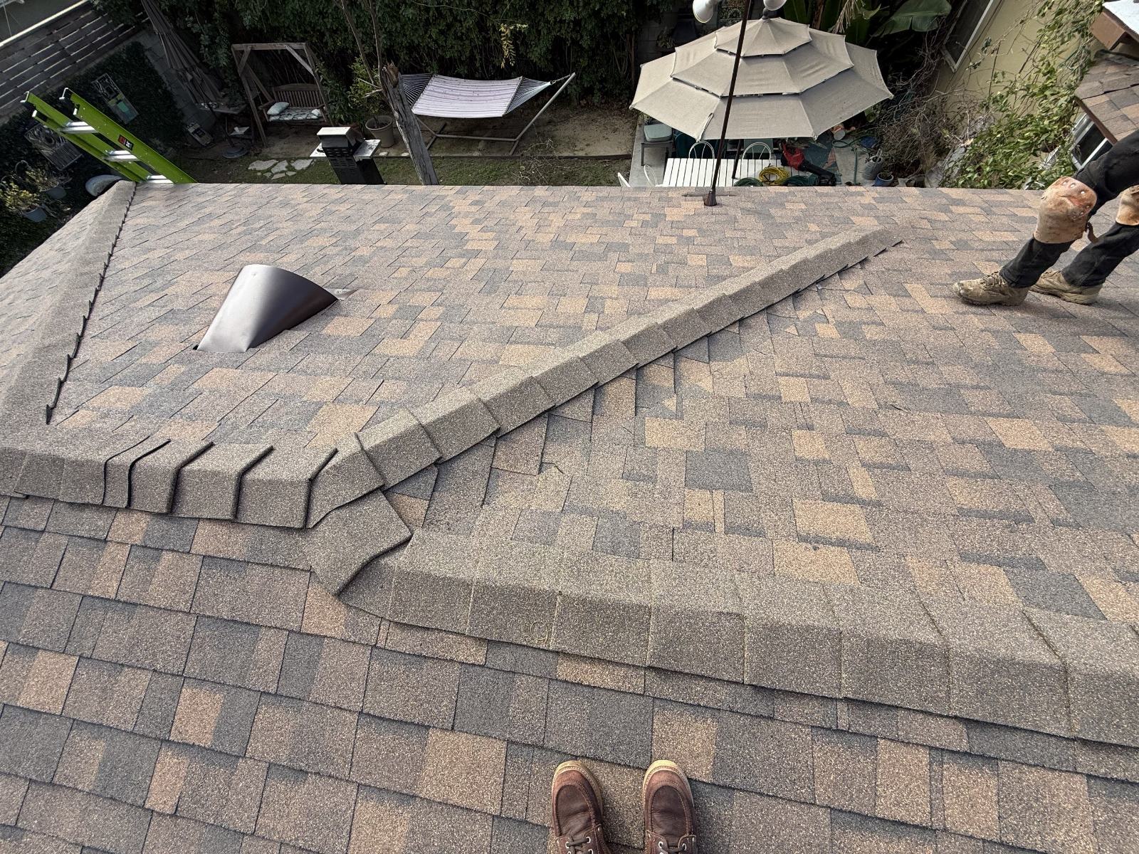 Asphalt shingle roof hip ridge cap installation with vent in Burbank | Roof Replacement Inc asphalt shingle roof hip ridge cap installation with vent — Burbank — Roof Replacement Inc