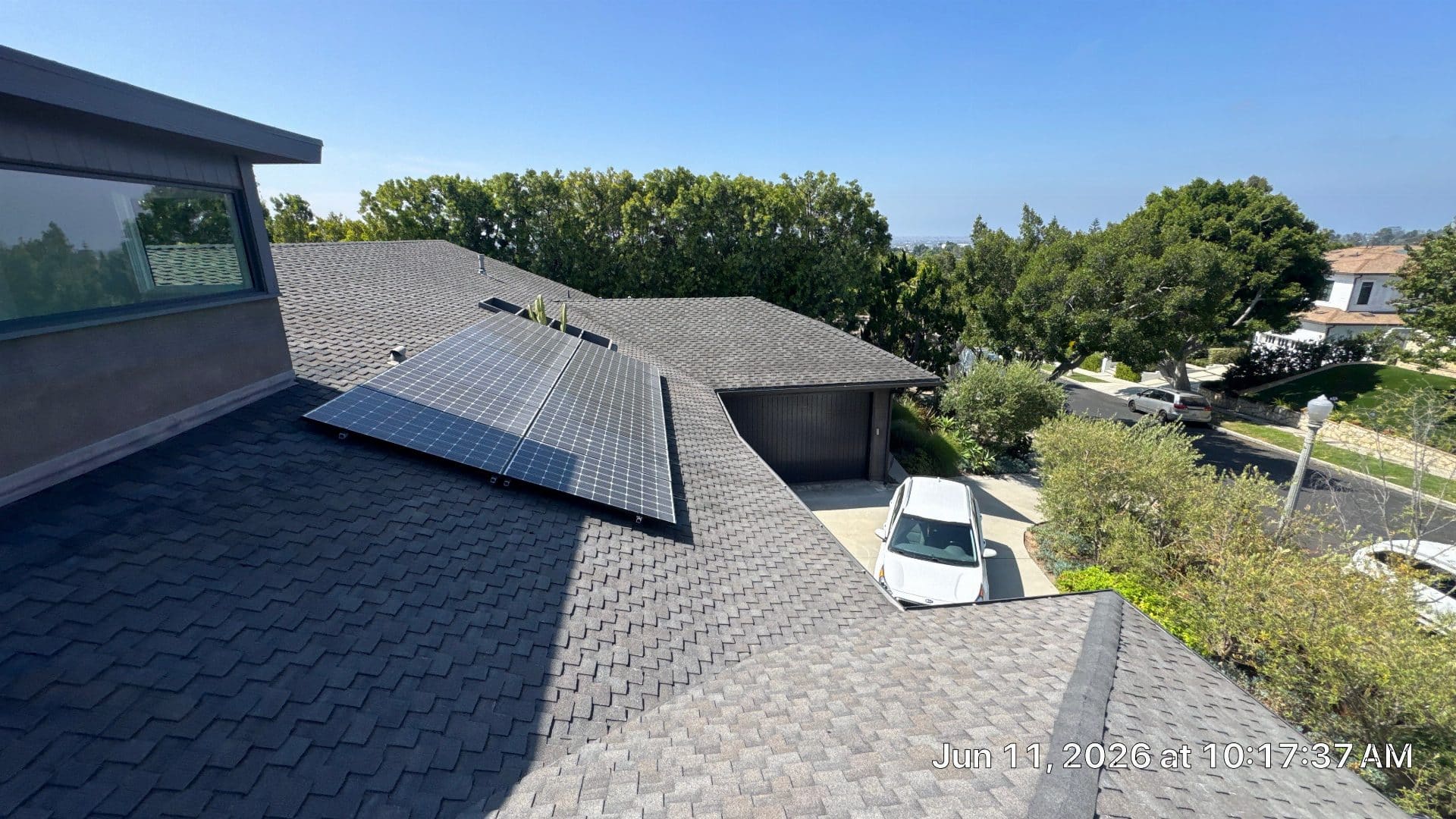 Solar panels installed on gray asphalt shingle residential roof in North Hollywood | Roof Replacement Inc solar panels installed on gray asphalt shingle residential roof — North Hollywood — Roof Replacement Inc