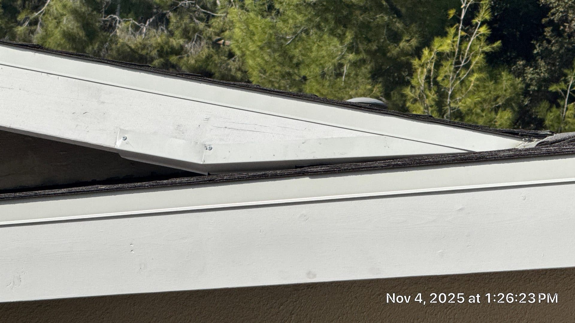 White metal fascia and drip edge over aged asphalt shingles | Roof Replacement Inc White metal fascia and drip edge over aged asphalt shingles — Roof Replacement Inc