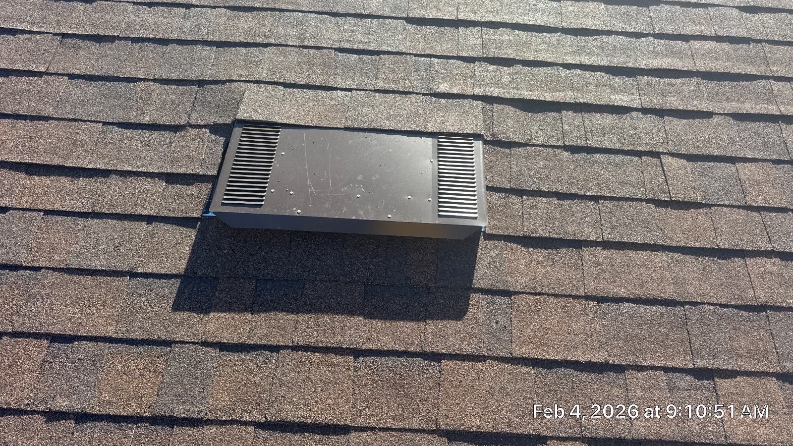 Metal roof louver vent installed on asphalt shingle roof — Roof Replacement Inc