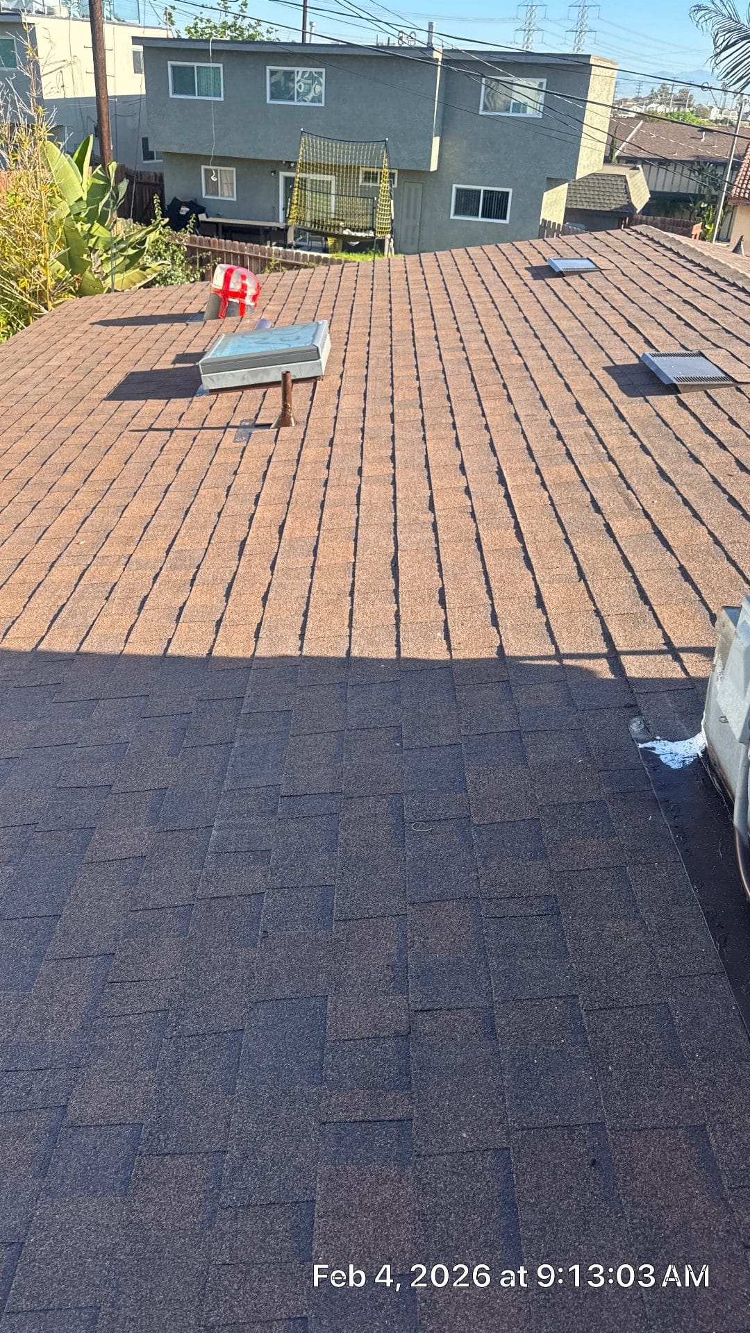 Newly installed asphalt shingle roof with two skylights and ventilation | Roof Replacement Inc Newly installed asphalt shingle roof with two skylights and ventilation — Roof Replacement Inc