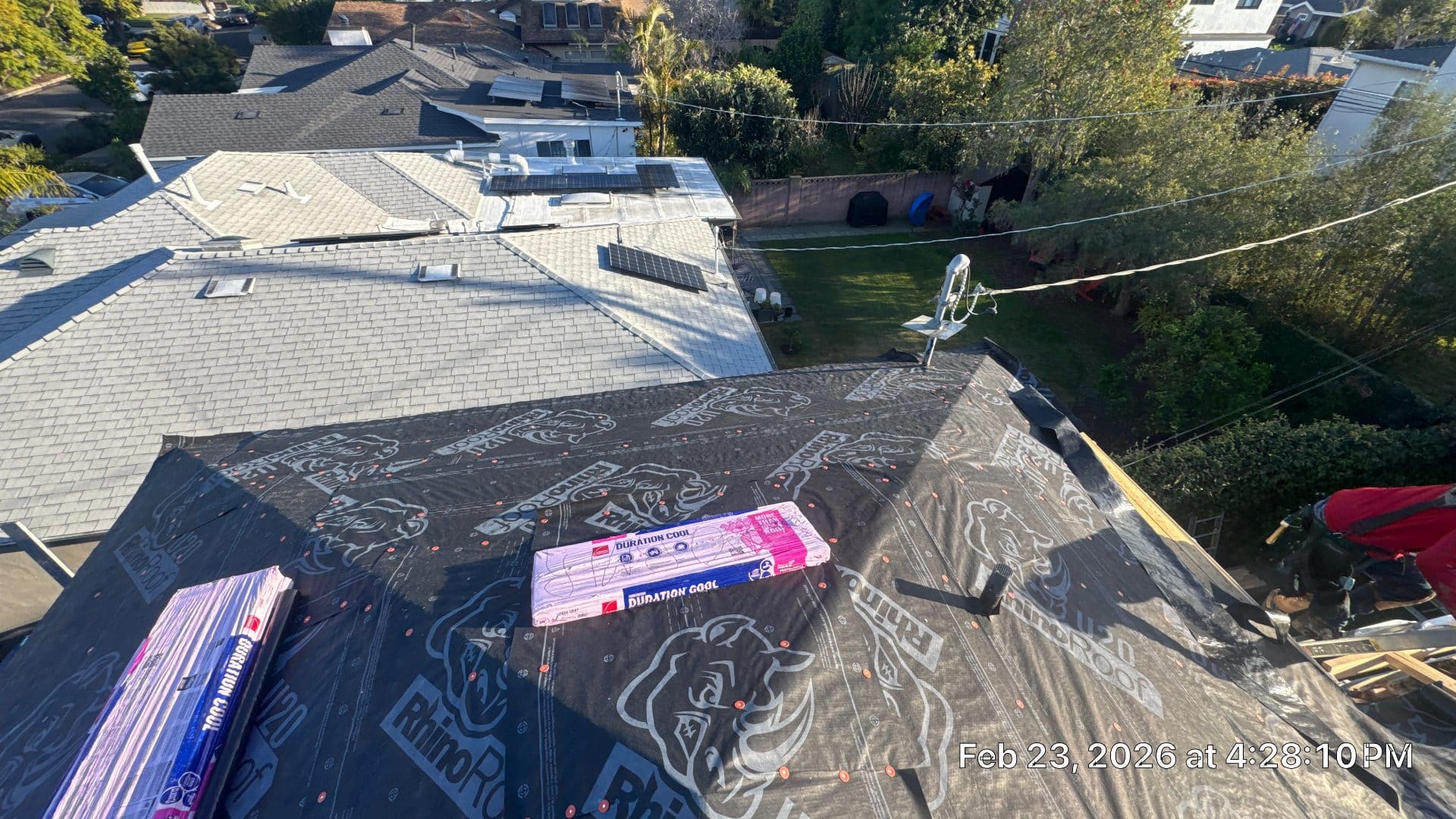 Roof deck covered in RhinoRoof underlayment with Duration Cool shingle bundles staged | Roof Replacement Inc Roof deck covered in RhinoRoof underlayment with Duration Cool shingle bundles staged — Roof Replacement Inc