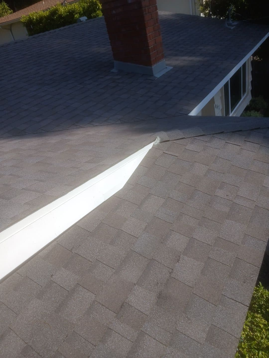 Asphalt shingle roofs, white aluminum valley flashing, brick chimney | Roof Replacement Inc Asphalt shingle roofs, white aluminum valley flashing, brick chimney — Roof Replacement Inc
