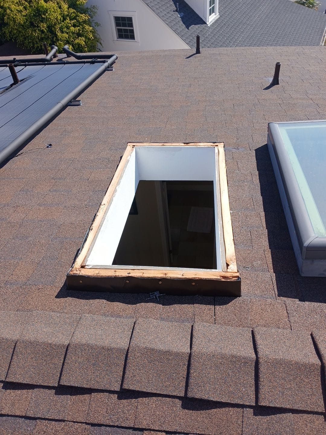 Skylight curb opening in asphalt shingle roof, replacement in progress | Roof Replacement Inc Skylight curb opening in asphalt shingle roof, replacement in progress — Roof Replacement Inc