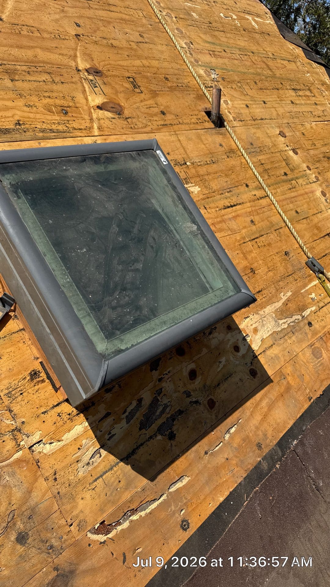 Skylight unit set on plywood roof deck during re-roof — Roof Replacement Inc