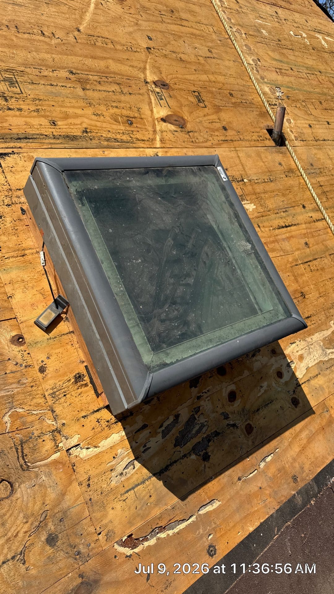 Skylight unit installed on plywood roof deck sheathing — Roof Replacement Inc