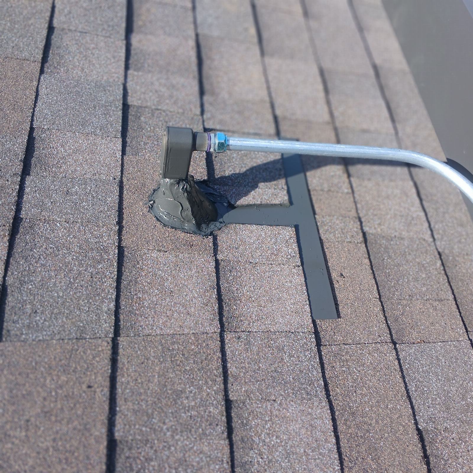 Solar panel mounting bracket bolted through asphalt shingle roof with sealant — Roof Replacement Inc