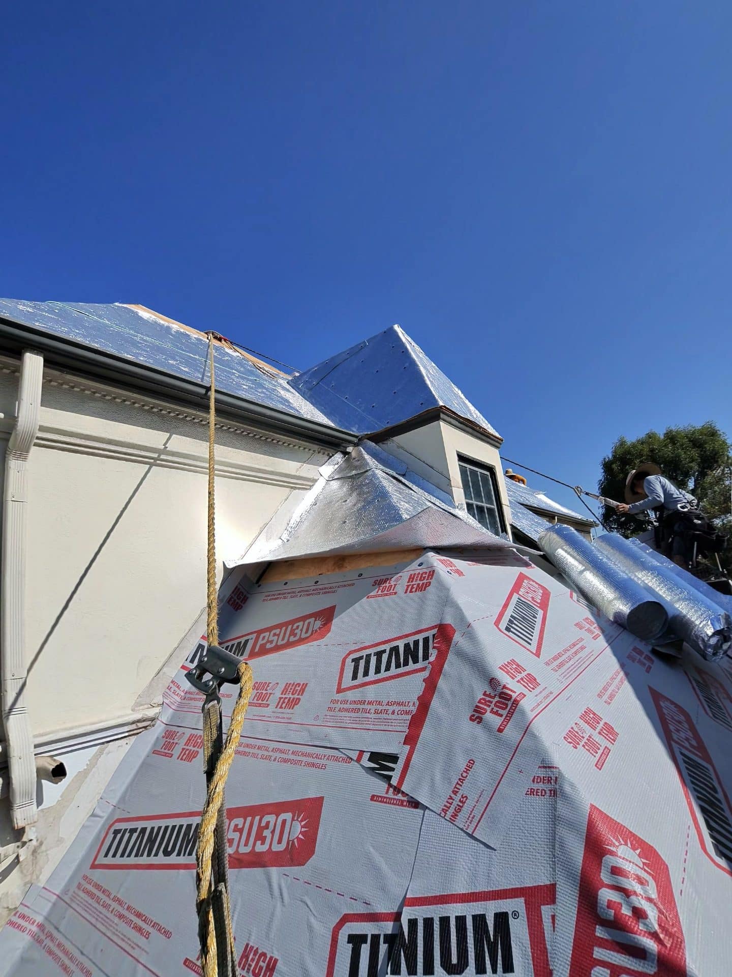Roof underlayment installation with Titanium PSU30, reflective barrier, valley flashing — Roof Replacement Inc