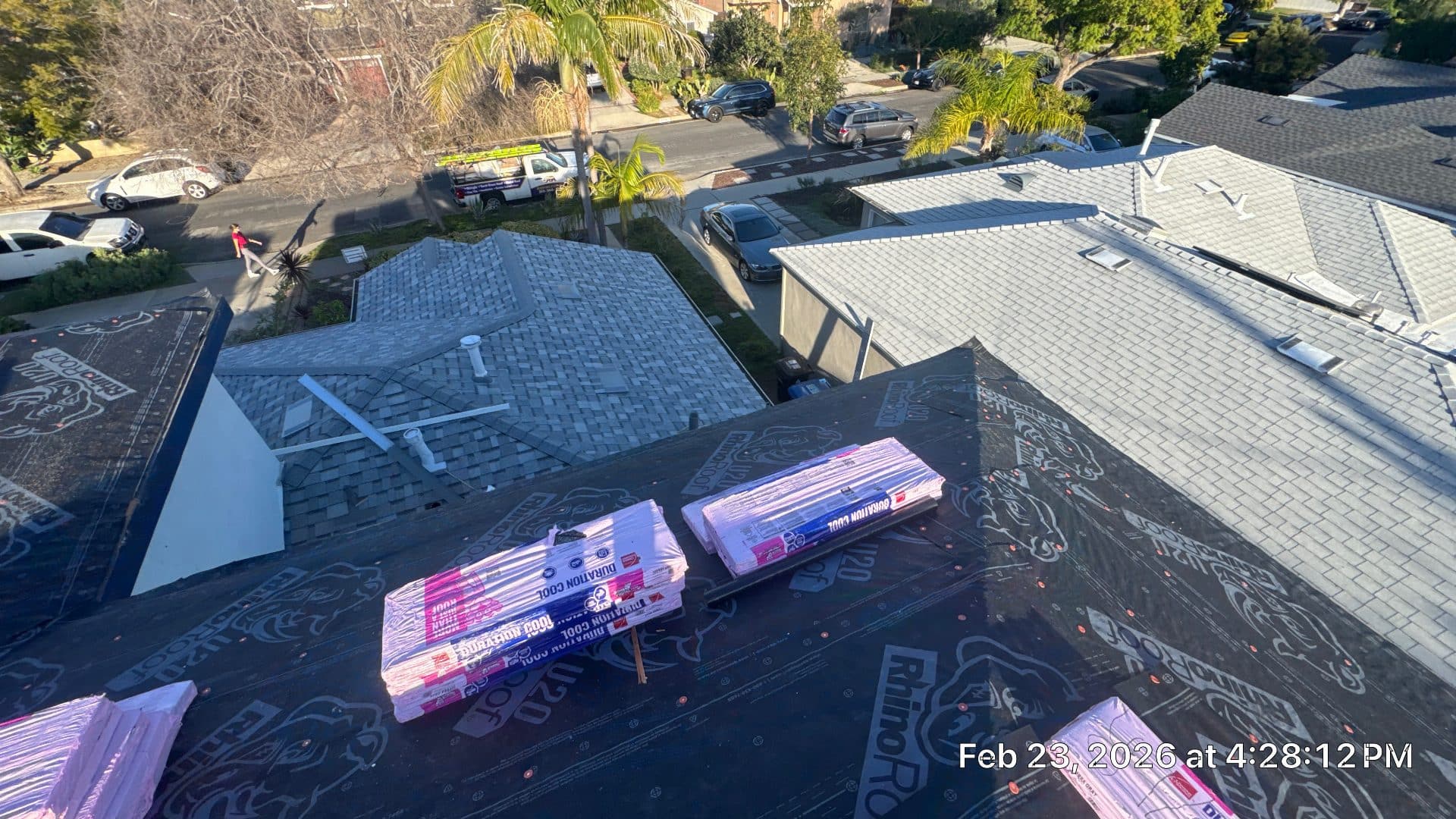 Roof deck with RhinoRoof underlayment, bundles of Duration Cool shingles staged | Roof Replacement Inc Roof deck with RhinoRoof underlayment, bundles of Duration Cool shingles staged — Roof Replacement Inc