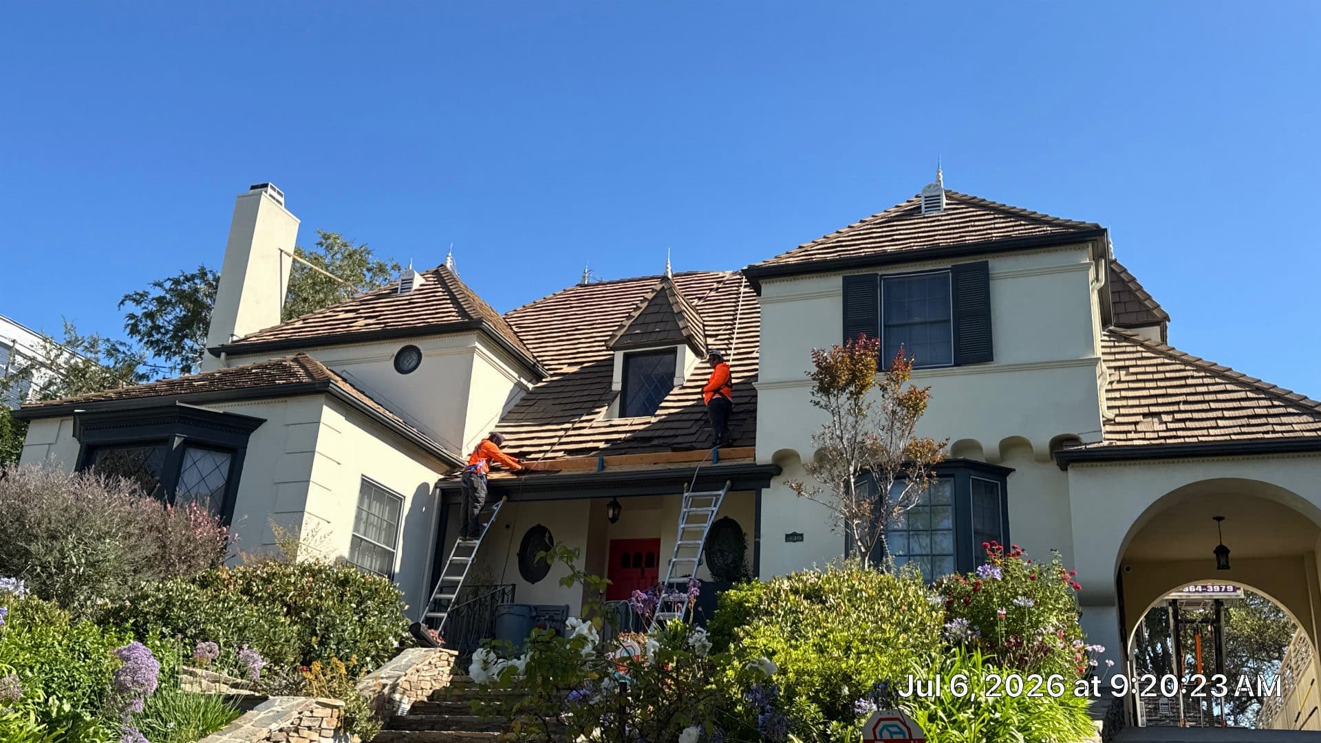 Workers on wood shake roof, ladders, dormers, stucco facade | Roof Replacement Inc Workers on wood shake roof, ladders, dormers, stucco facade — Roof Replacement Inc
