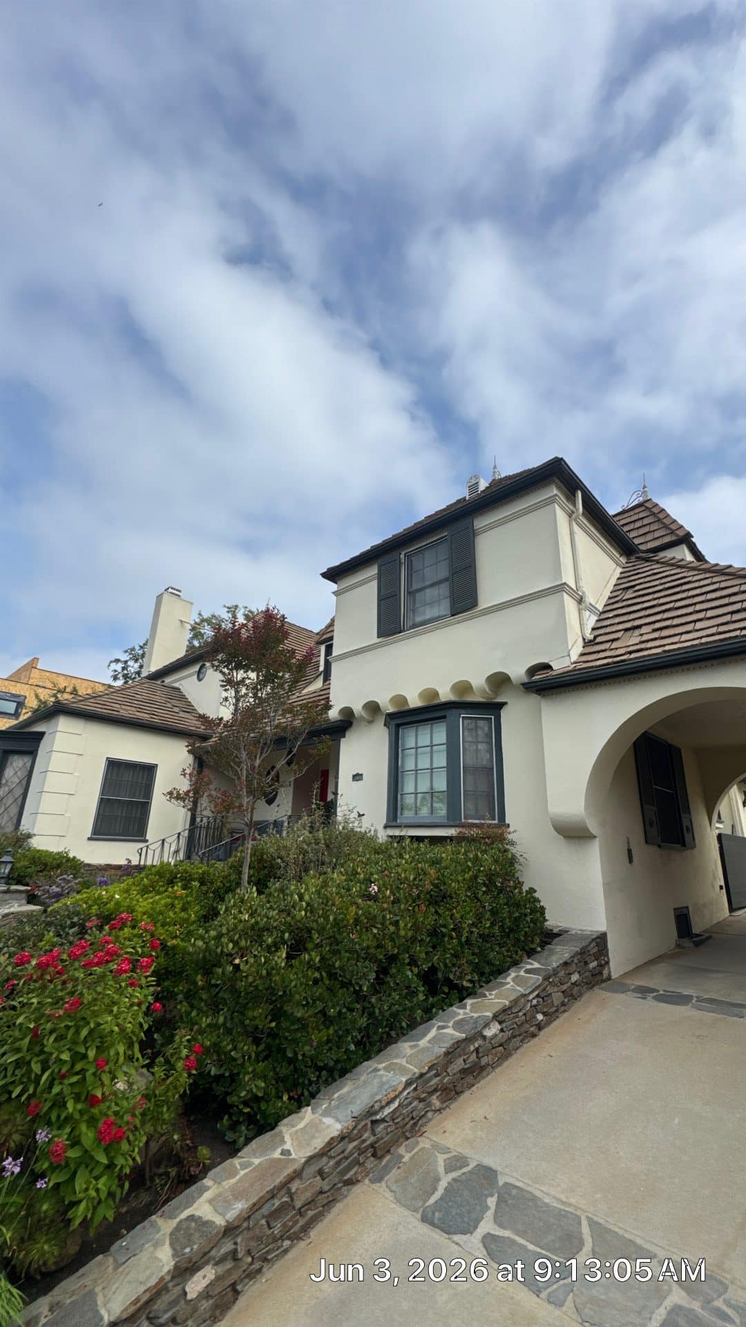 Two-story stucco home with wood shake shingle roof and arched porte-cochere | Roof Replacement Inc Two-story stucco home with wood shake shingle roof and arched porte-cochere — Roof Replacement Inc