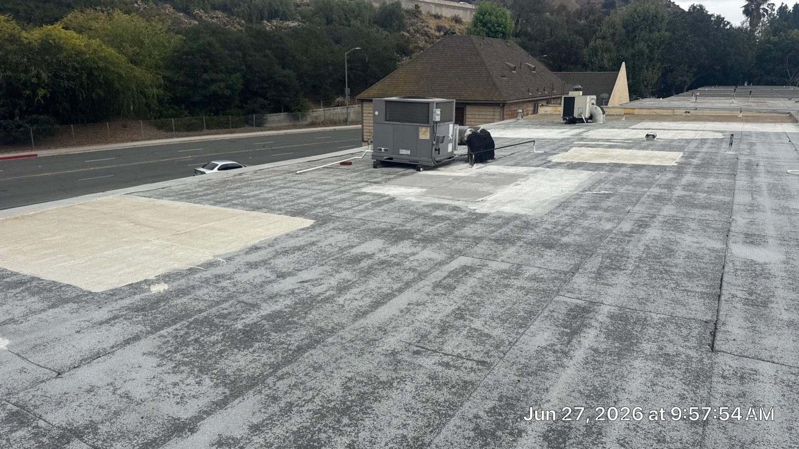 Completed torch down flat roof installation work at Roof Replacement Inc