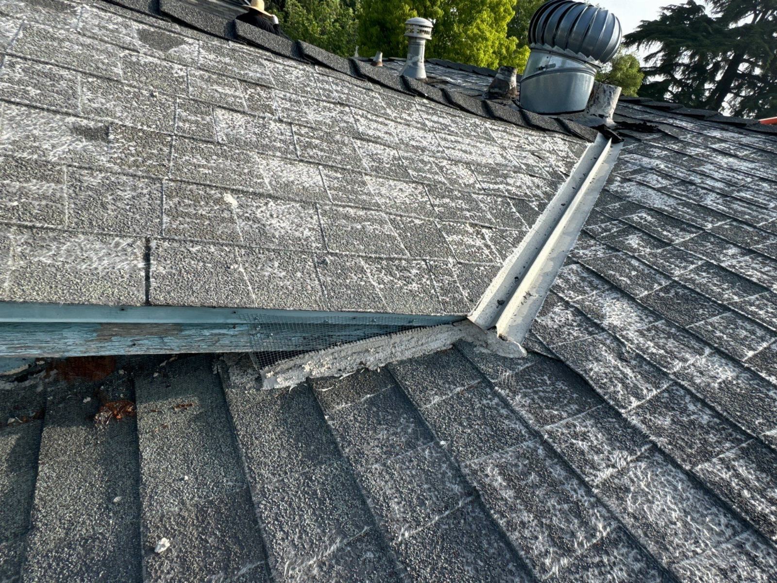 Aged asphalt shingle roof with hip ridge, metal flashing, wire mesh, and turbine vents — Burbank — Roof Replacement Inc