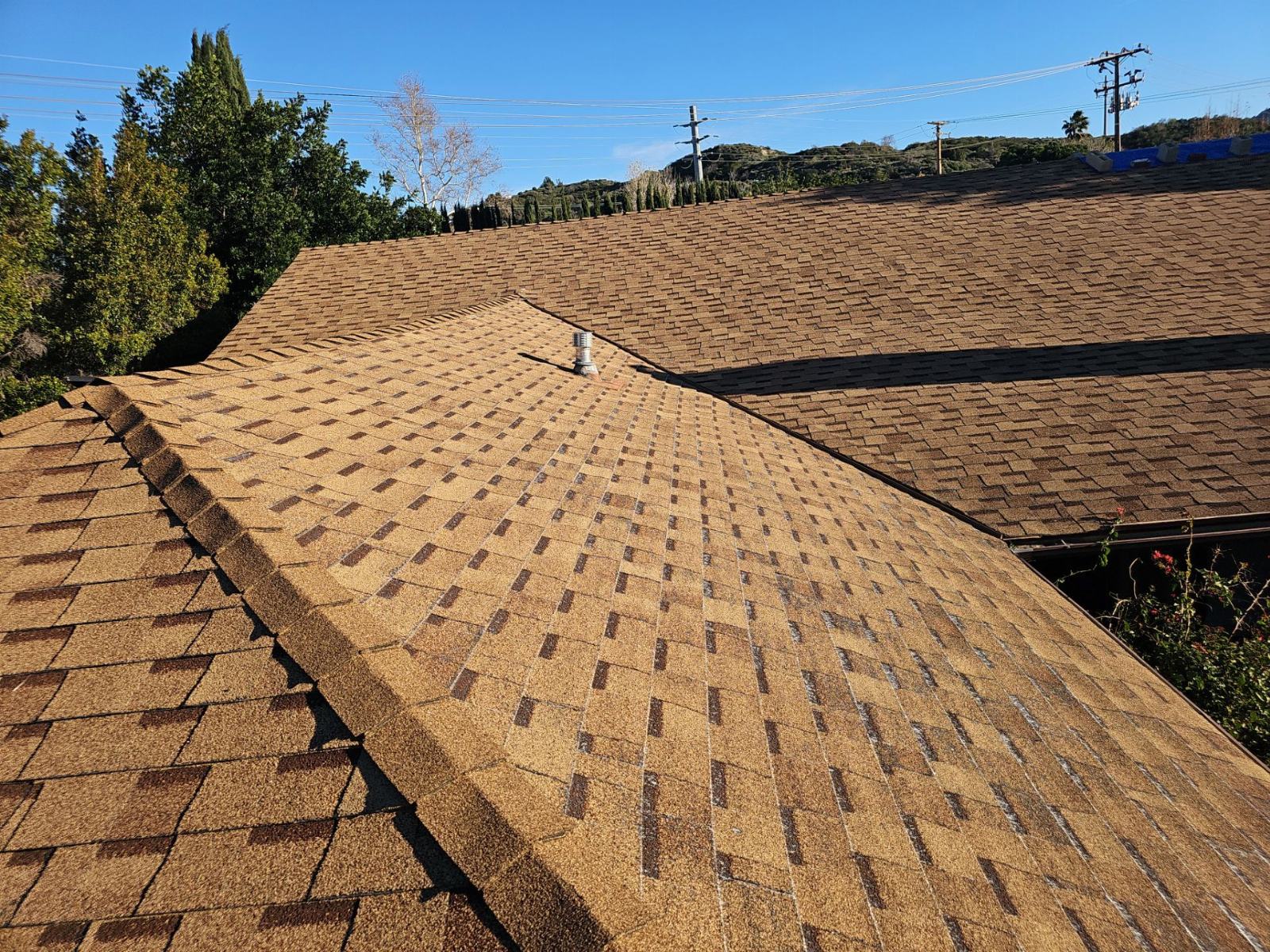 Asphalt shingle roof with hip ridges and roof vent | Roof Replacement Inc Asphalt shingle roof with hip ridges and roof vent — Roof Replacement Inc