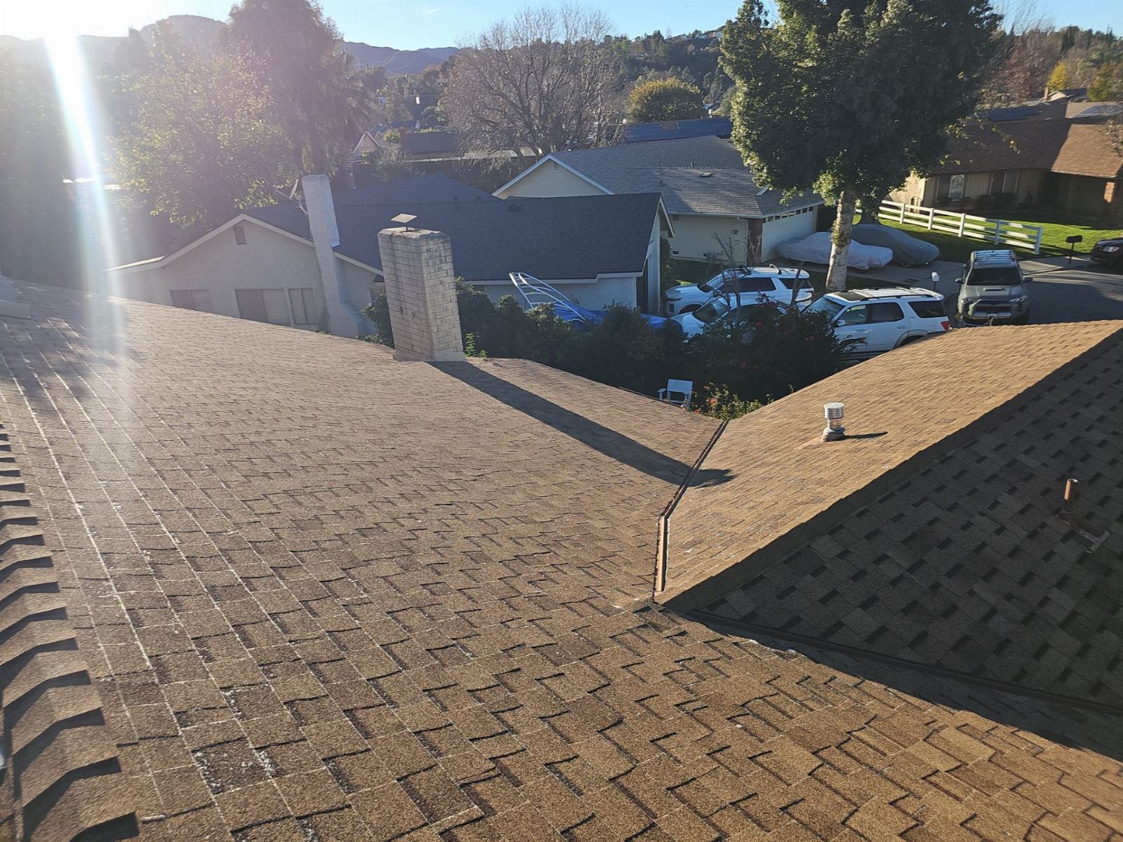 Asphalt shingle roof with chimney, valley, and plumbing vent | Roof Replacement Inc Asphalt shingle roof with chimney, valley, and plumbing vent — Roof Replacement Inc