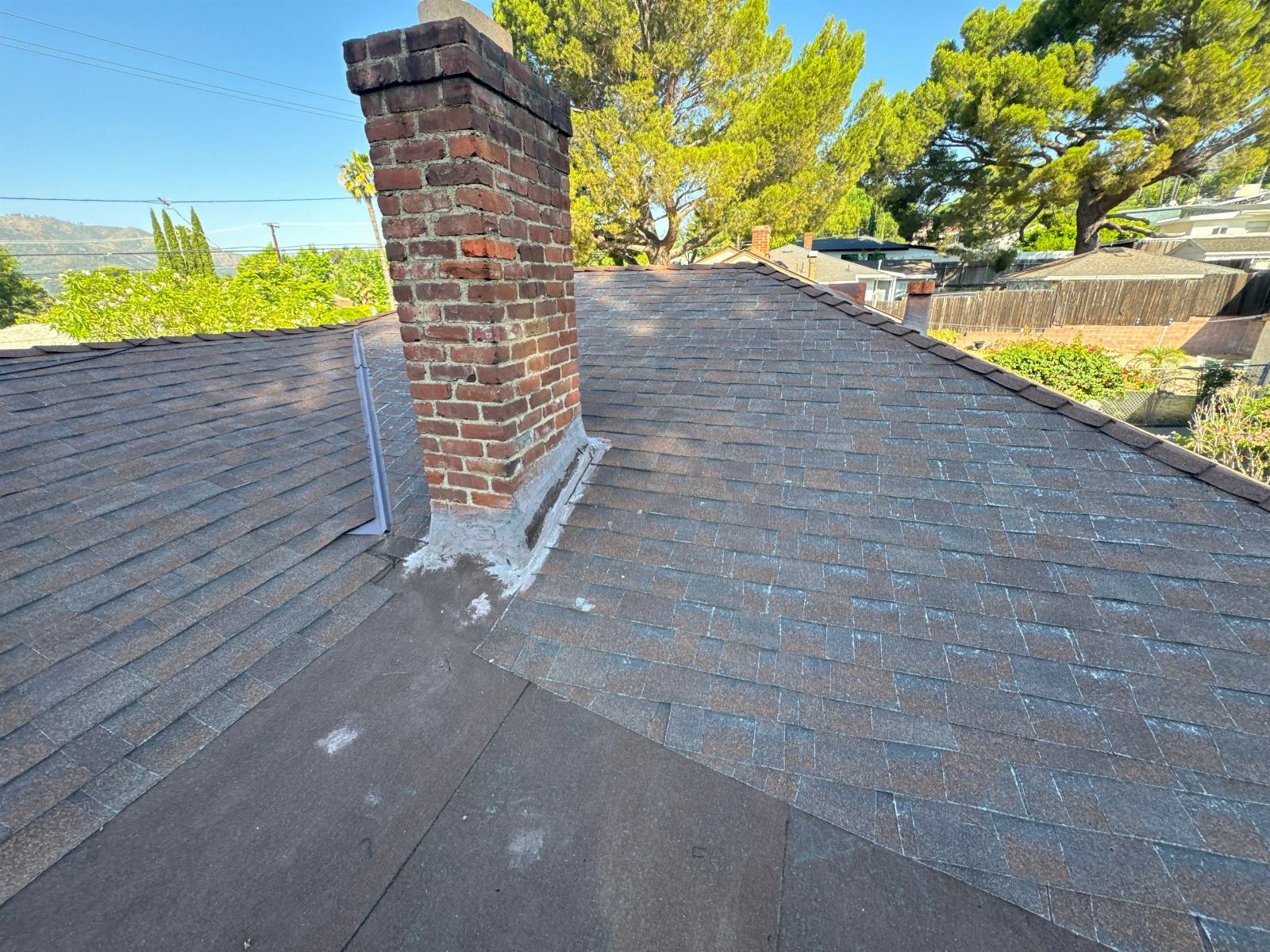 Asphalt shingle roof with brick chimney and mortar patching in La Crescenta-Montrose | Roof Replacement Inc Asphalt shingle roof with brick chimney and mortar patching — La Crescenta-Montrose — Roof Replacement Inc