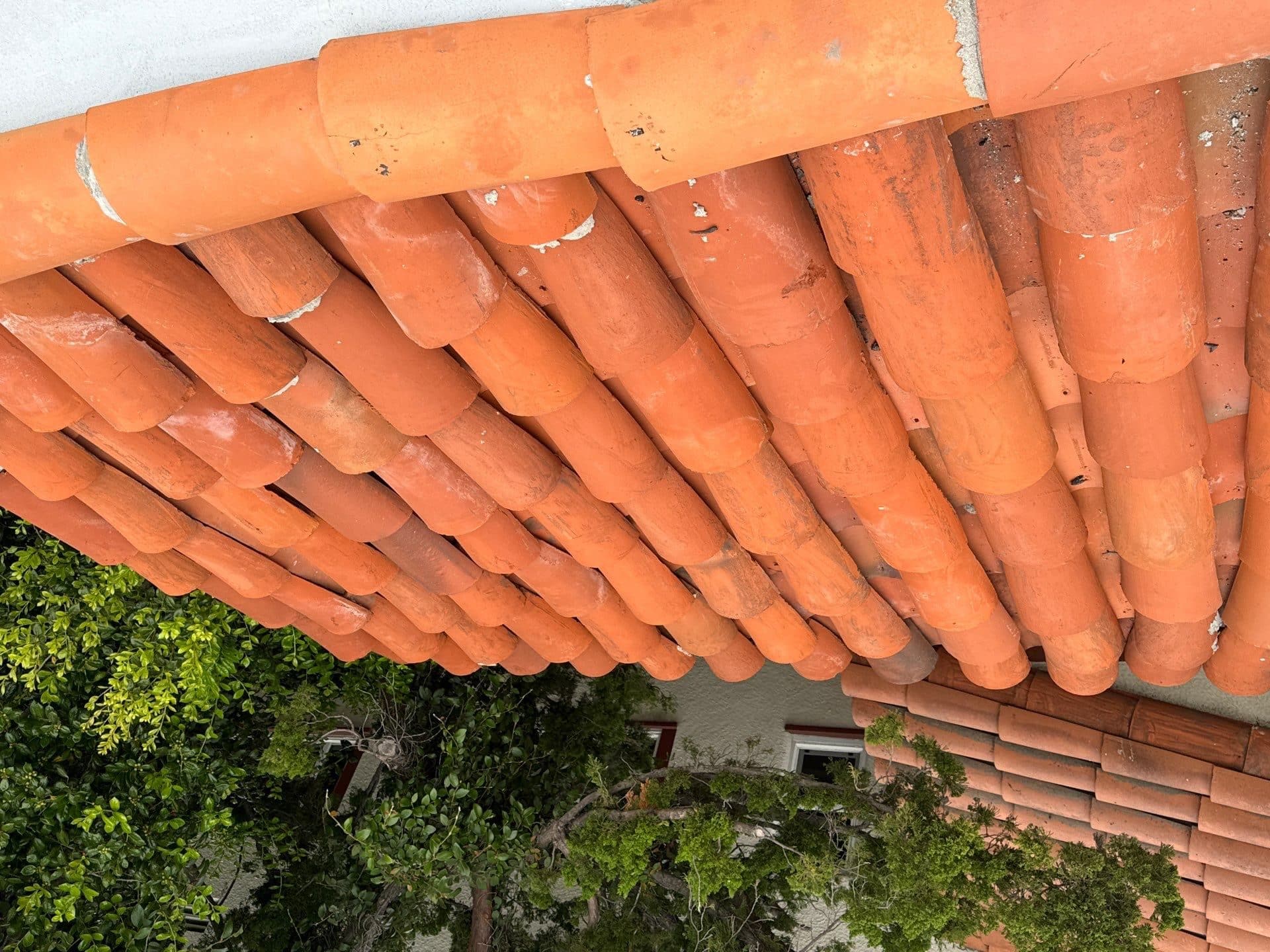 Clay barrel tile roof eave close-up, terracotta tiles — Glendale — Roof Replacement Inc