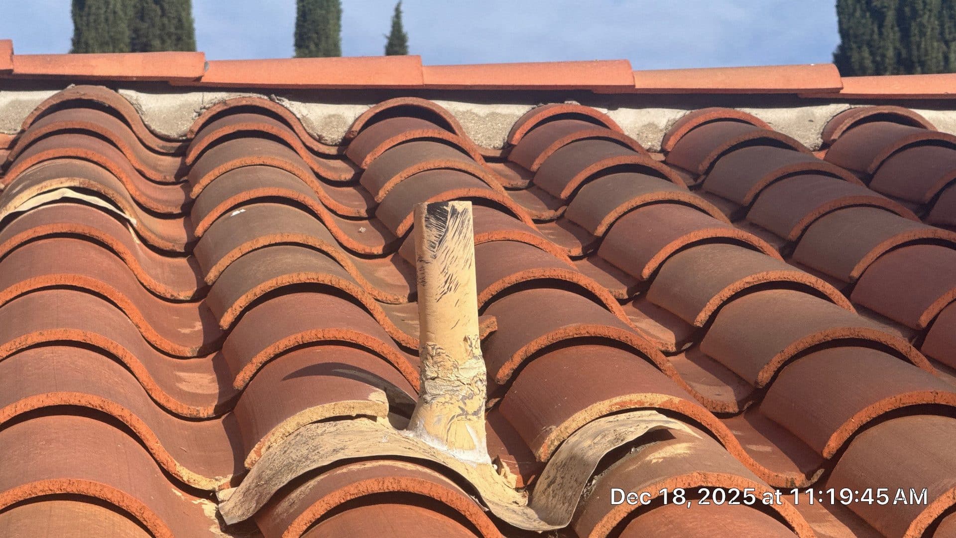 Damaged pipe boot flashing on clay barrel tile roof in Calabasas | Roof Replacement Inc Damaged pipe boot flashing on clay barrel tile roof — Calabasas — Roof Replacement Inc