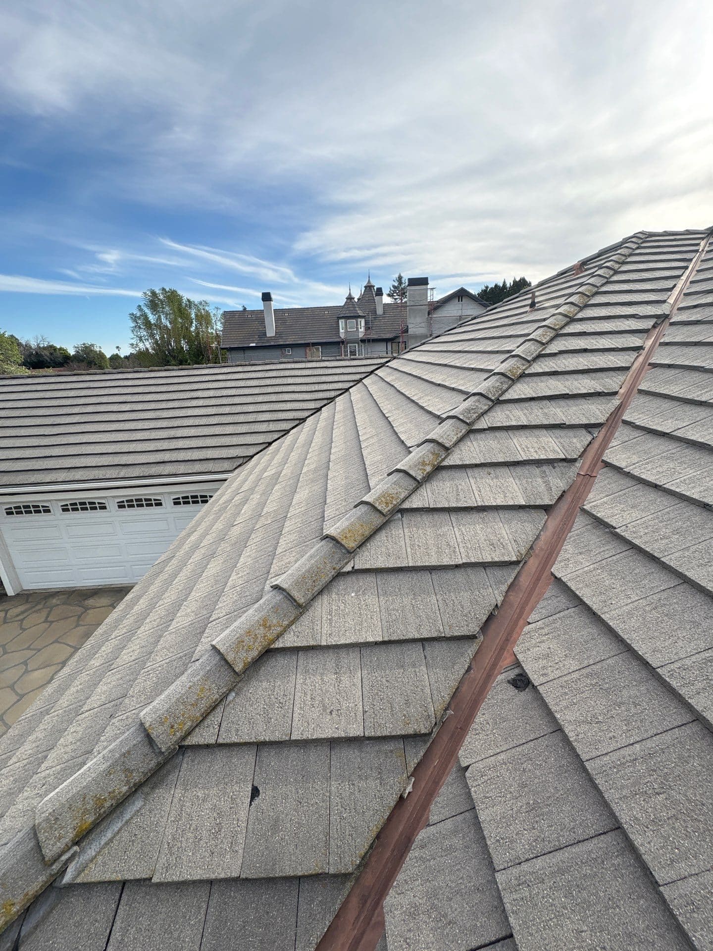 Concrete tile roof with hip ridges and copper valley flashing in Northridge | Roof Replacement Inc Concrete tile roof with hip ridges and copper valley flashing — Northridge — Roof Replacement Inc