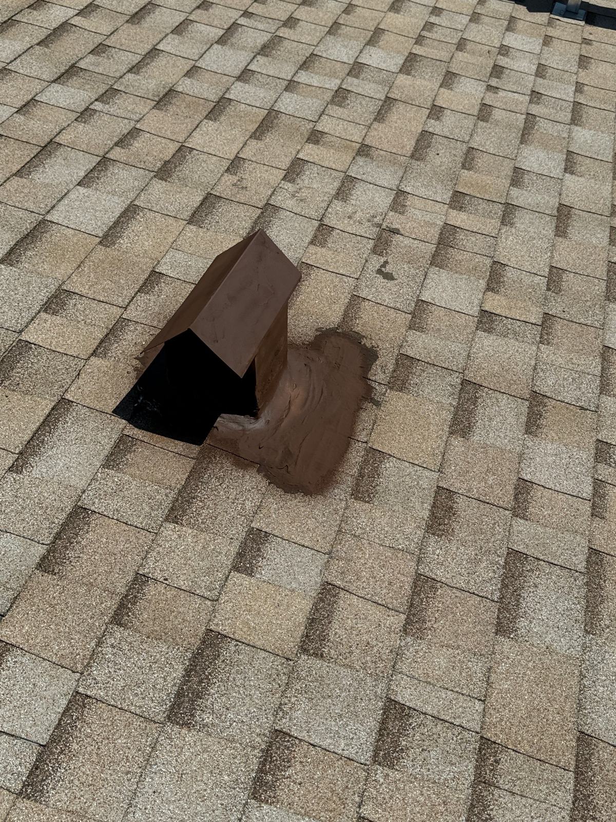 Damaged roof vent boot with sealant on asphalt shingles | Roof Replacement Inc Damaged roof vent boot with sealant on asphalt shingles — Roof Replacement Inc