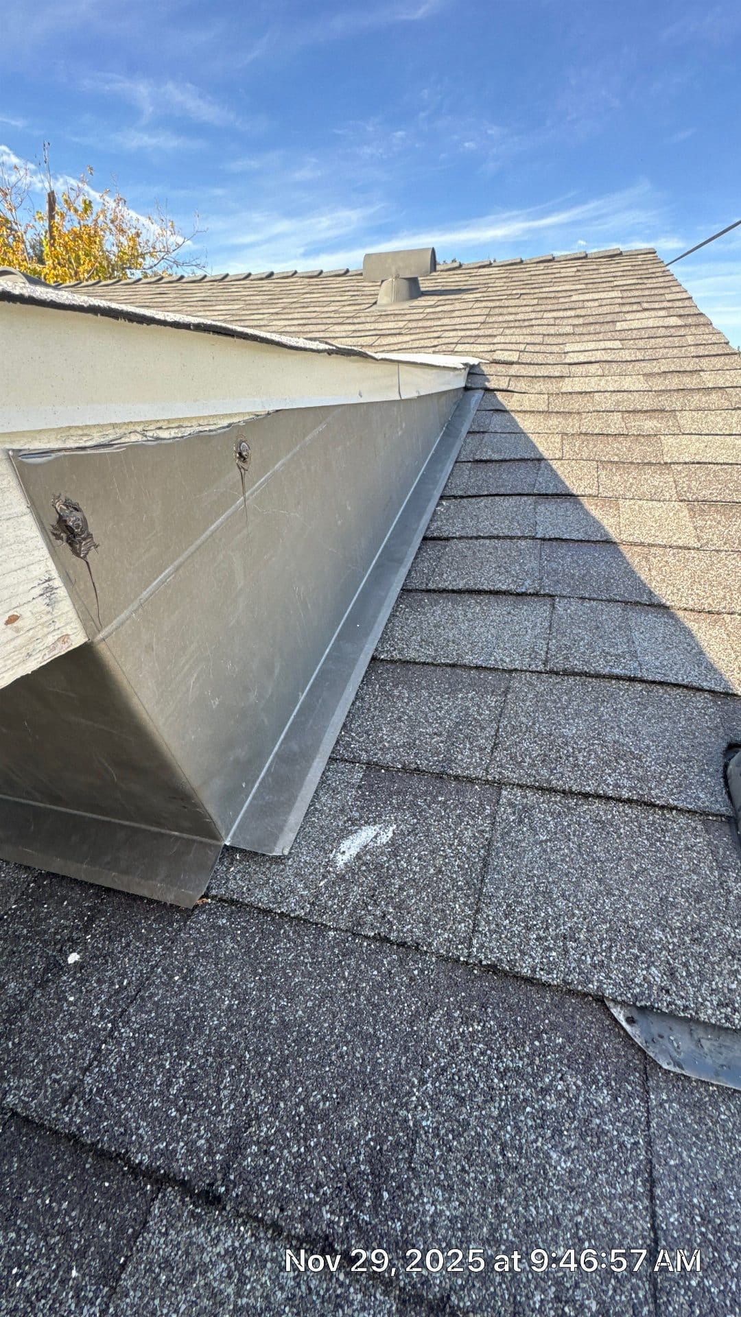 Metal step flashing at dormer-to-asphalt-shingle roof junction | Roof Replacement Inc Metal step flashing at dormer-to-asphalt-shingle roof junction — Roof Replacement Inc