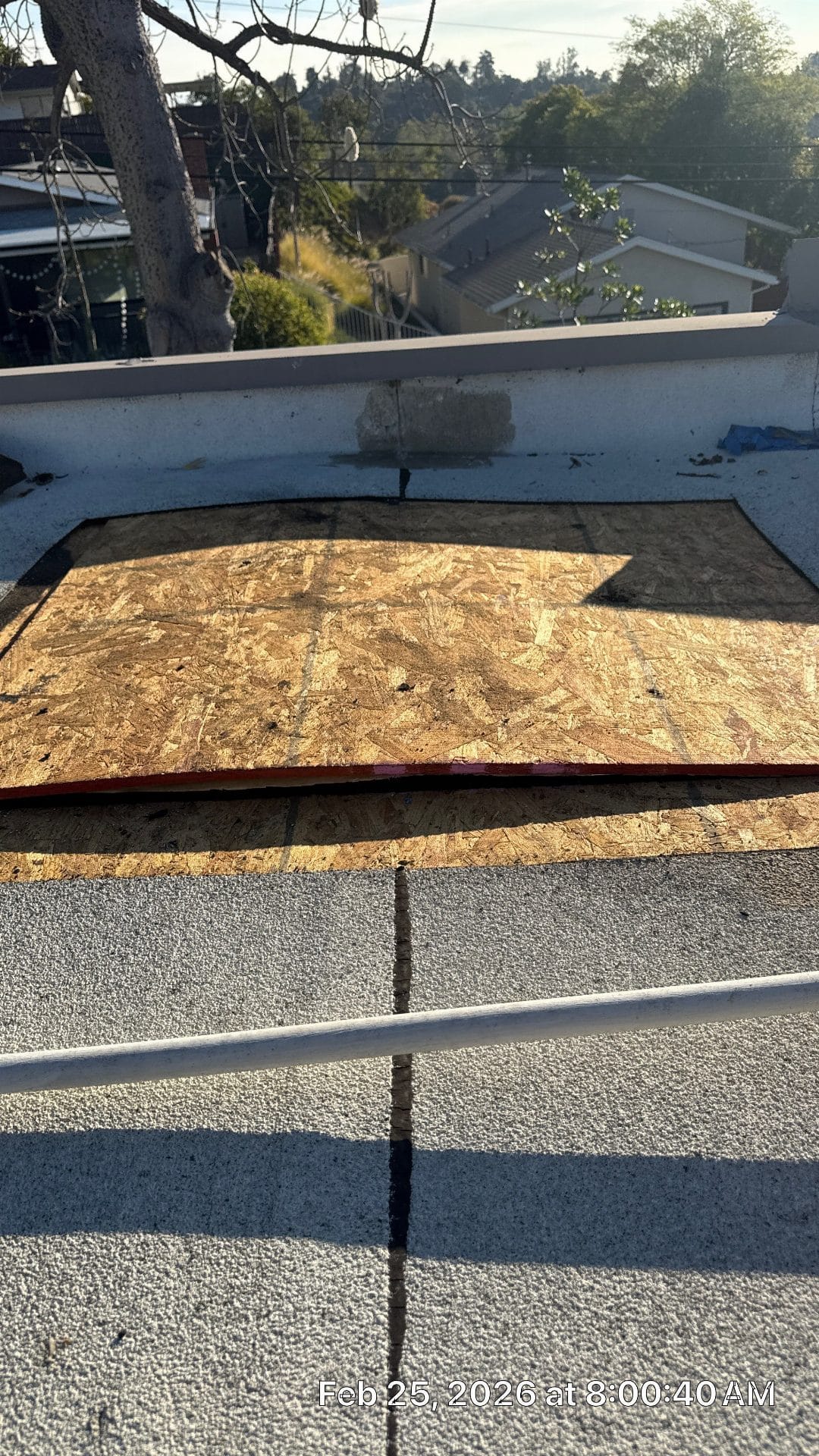 OSB decking patch on flat roof with modified bitumen membrane in Highland Park | Roof Replacement Inc OSB decking patch on flat roof with modified bitumen membrane — Highland Park — Roof Replacement Inc