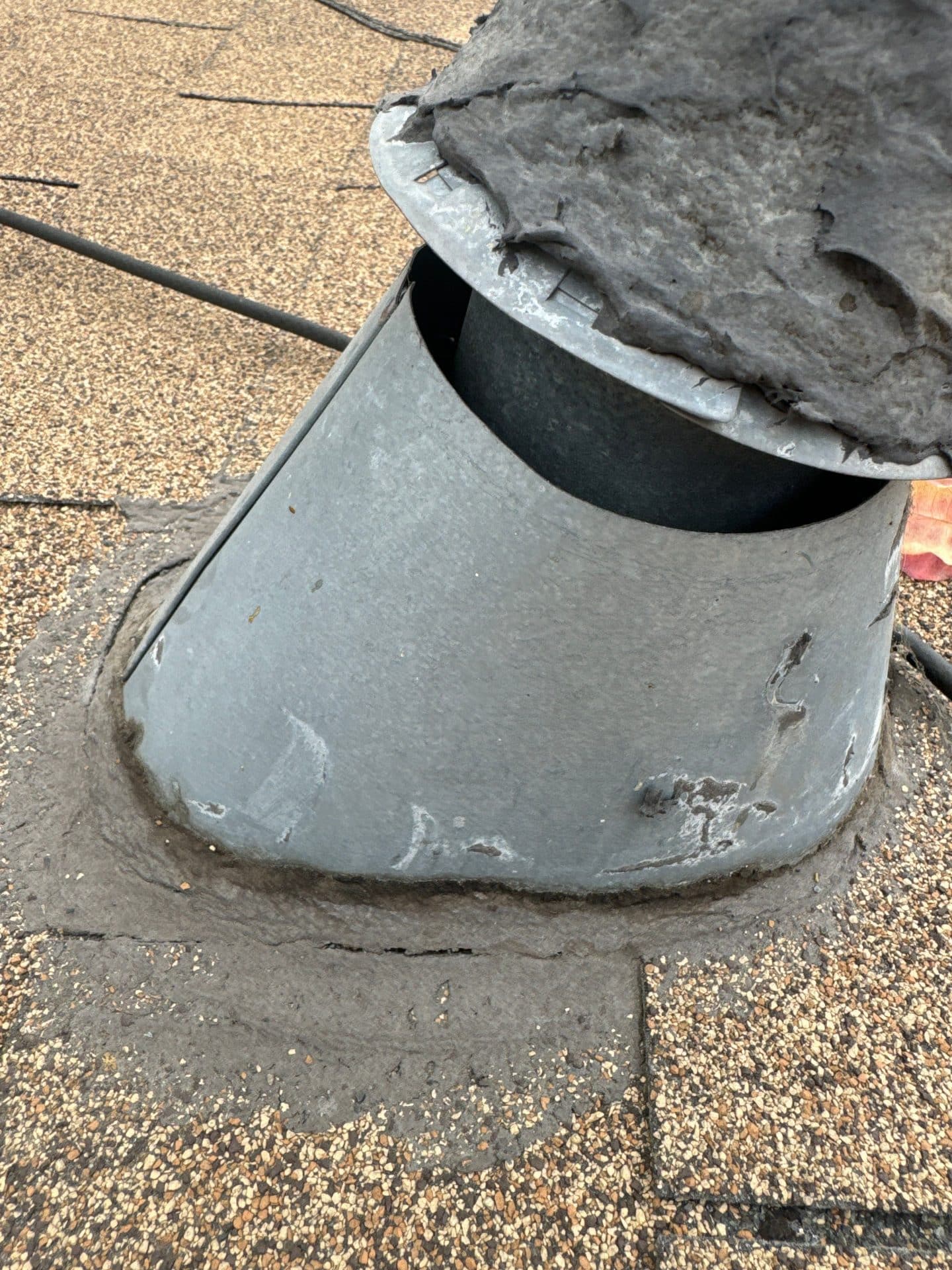 Damaged pipe boot flashing on asphalt shingle roof in Echo Park | Roof Replacement Inc Damaged pipe boot flashing on asphalt shingle roof — Echo Park — Roof Replacement Inc