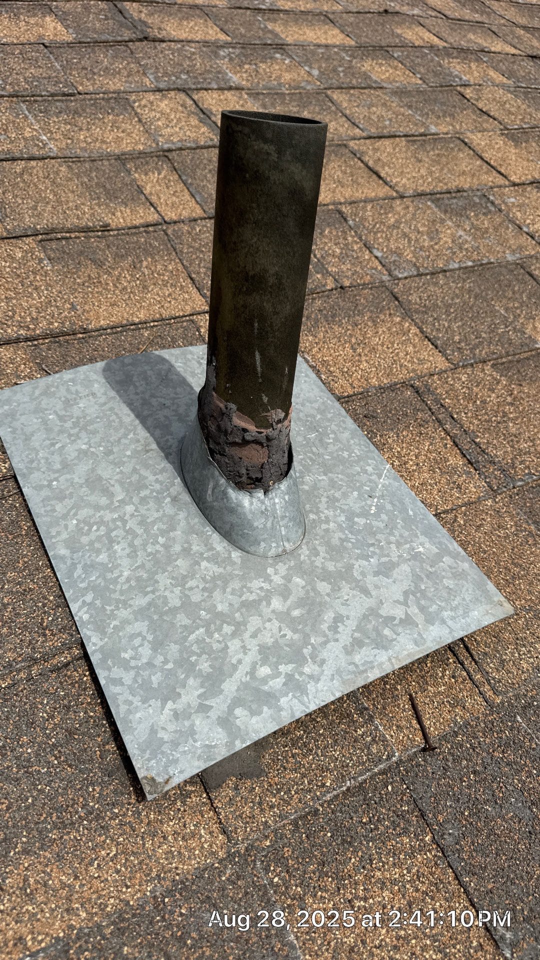 Galvanized flashing around a rusted vent pipe on an asphalt shingle roof — Altadena — Roof Replacement Inc