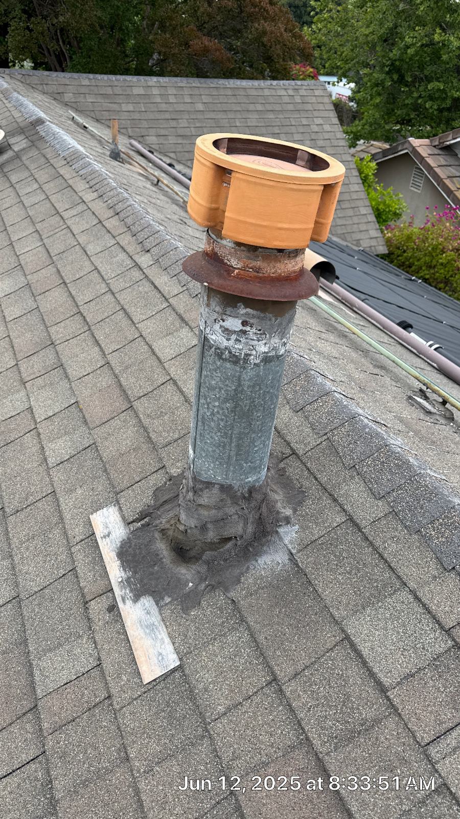 Galvanized pipe flashing with clay cap on asphalt shingle roof — North Hollywood — Roof Replacement Inc