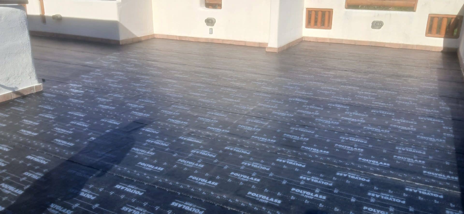 Flat roof covered with Polyglass self-adhered underlayment membrane in Bell Canyon | Roof Replacement Inc Flat roof covered with Polyglass self-adhered underlayment membrane — Bell Canyon — Roof Replacement Inc
