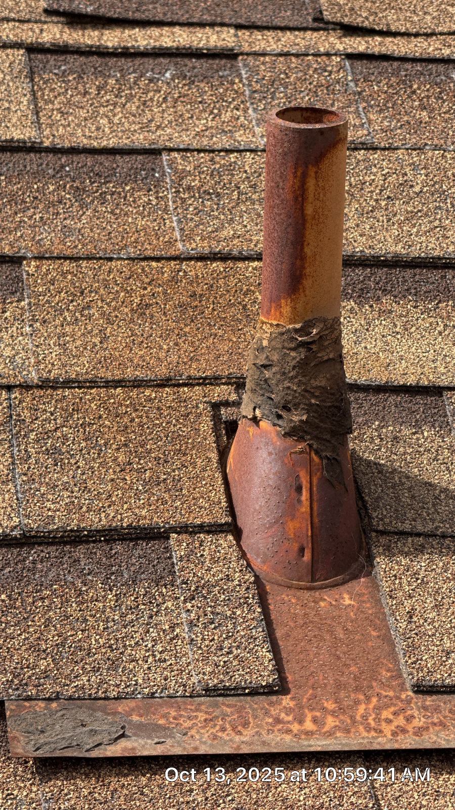 Heavily rusted plumbing vent pipe and boot flashing on asphalt shingle roof in Burbank | Roof Replacement Inc Heavily rusted plumbing vent pipe and boot flashing on asphalt shingle roof — Burbank — Roof Replacement Inc