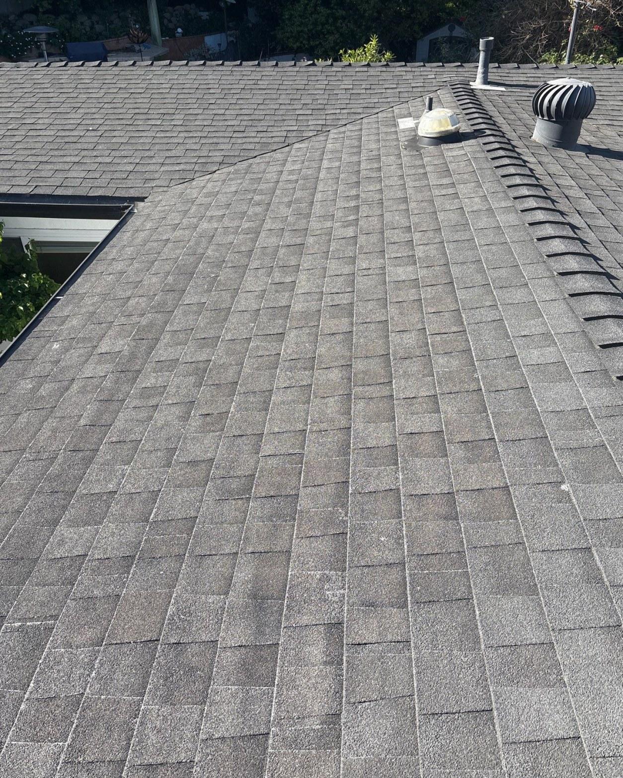 mid-century-home-standing-seam-metal-roof-skip-sheathing-4390 Worn composition shingle roof on a mid-century home in Rancho Palos Verdes showing granule loss and aged turbine vents