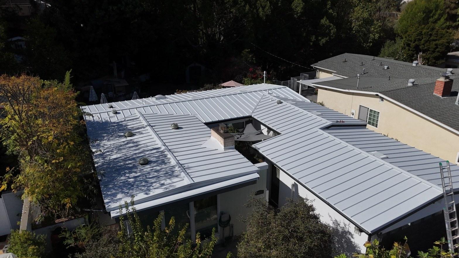 Standing seam metal roof new roof installation aerial view